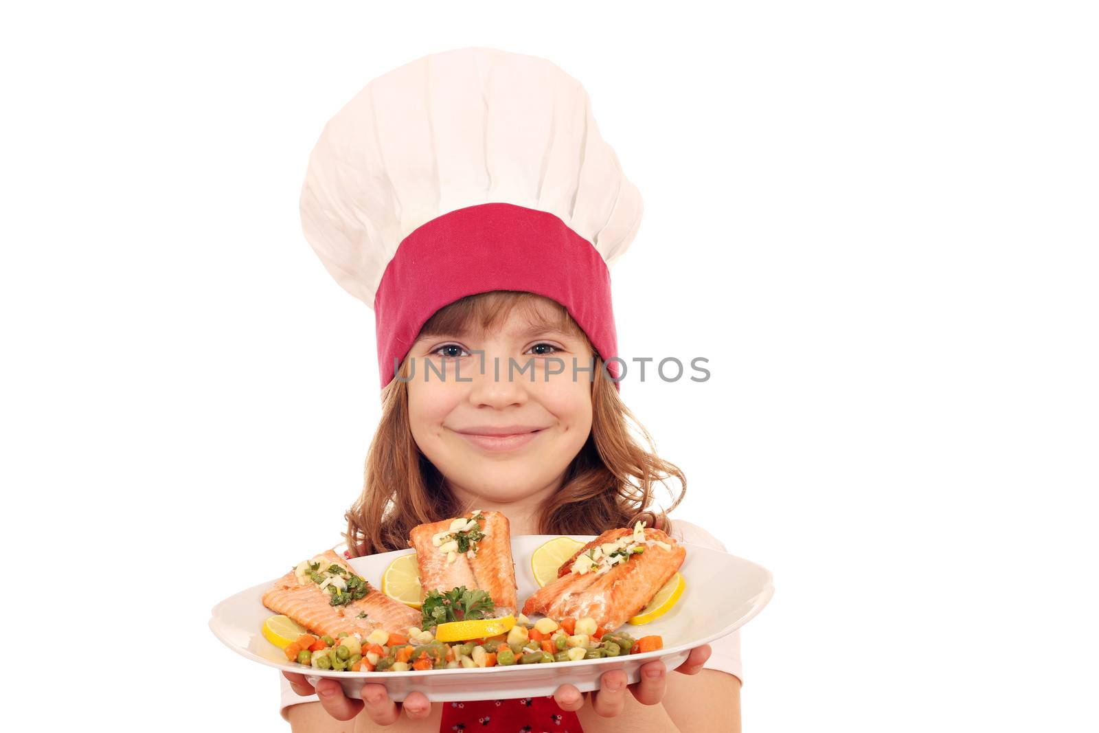 happy little girl cook hold plate with salmon seafood by goce