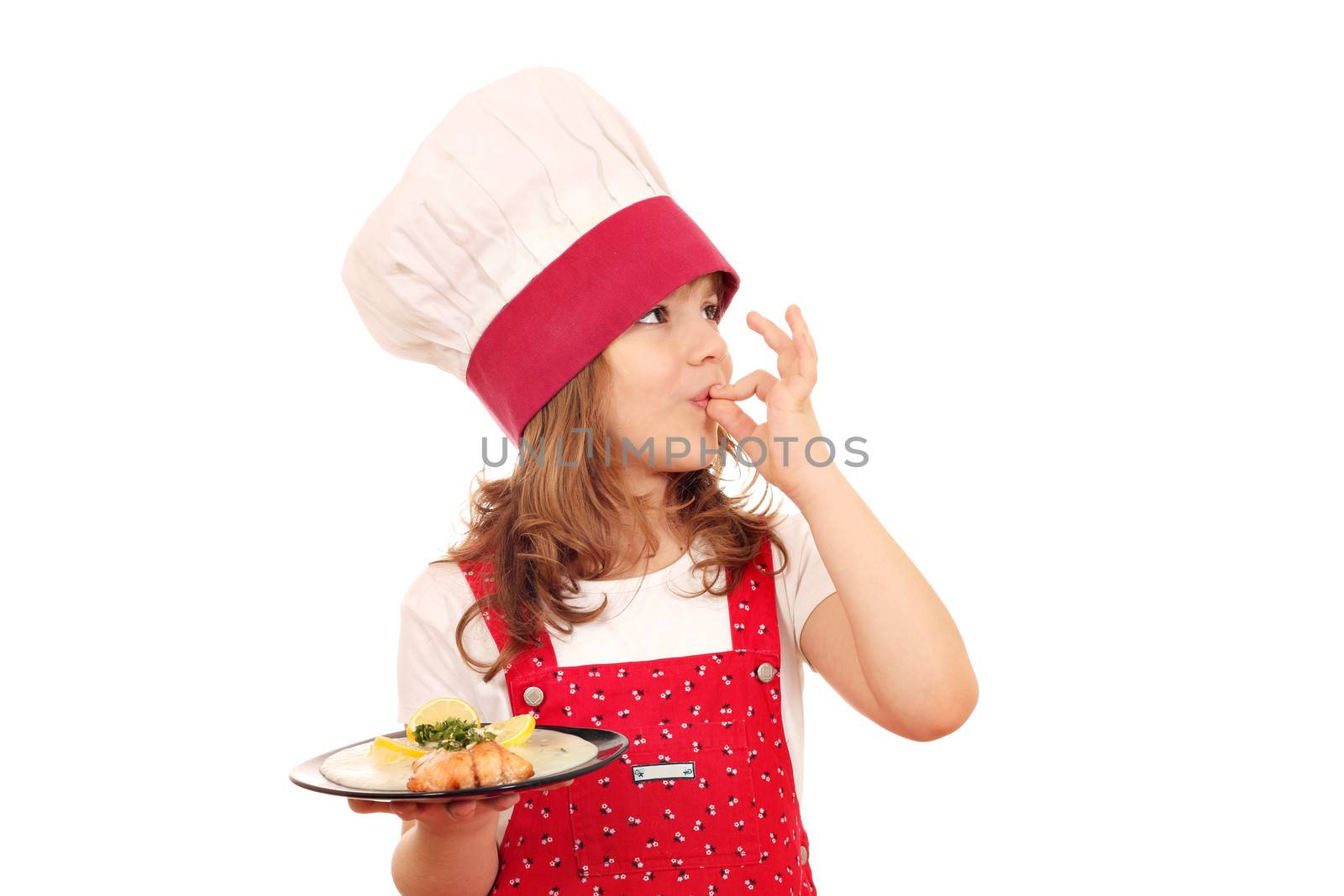 little girl cook with salmon and ok hand sign by goce