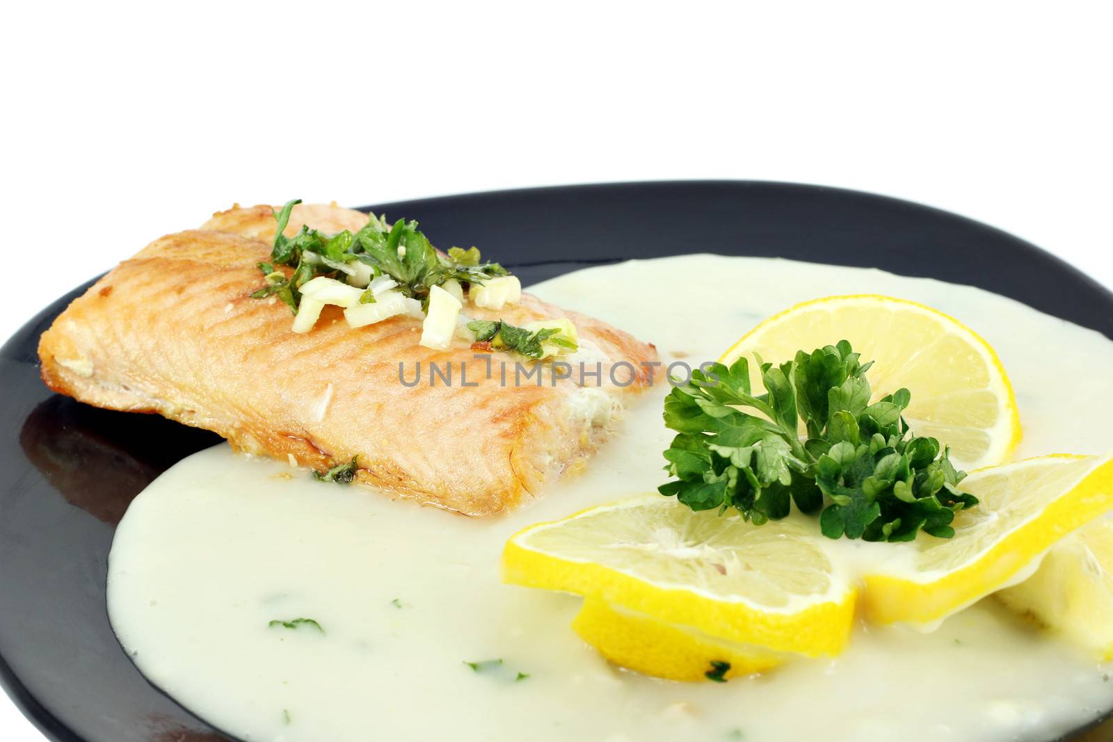 salmon steak with lemon and sauce by goce