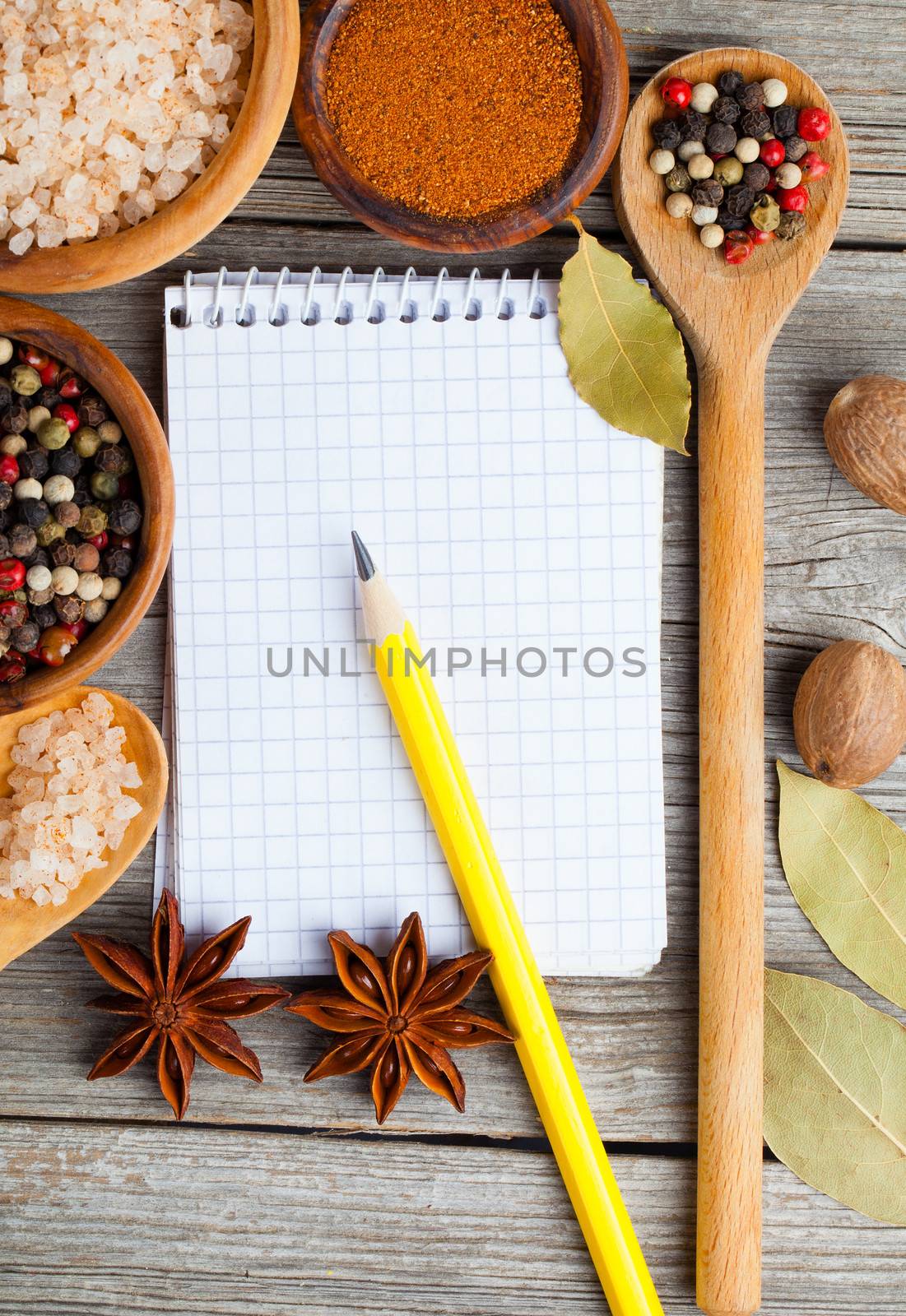 top view of recipe book with ingredients on wooden table by motorolka