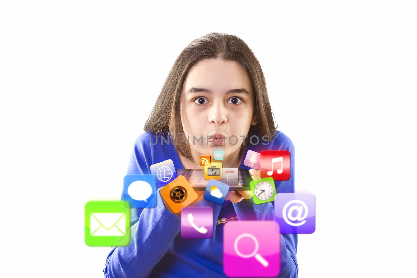 Teenage girl blowing icons from digital tablet by manaemedia