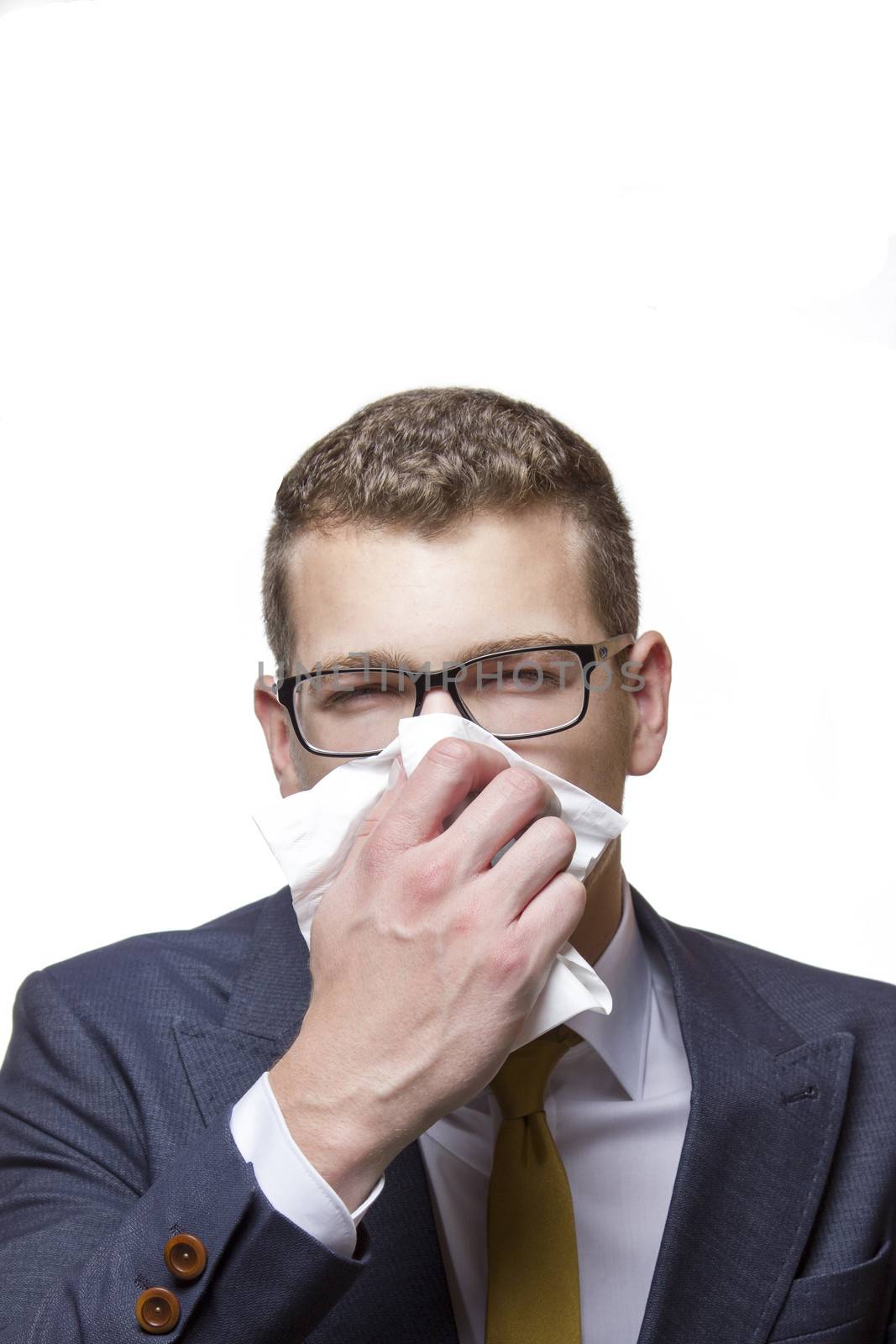 Young business man using a tissue