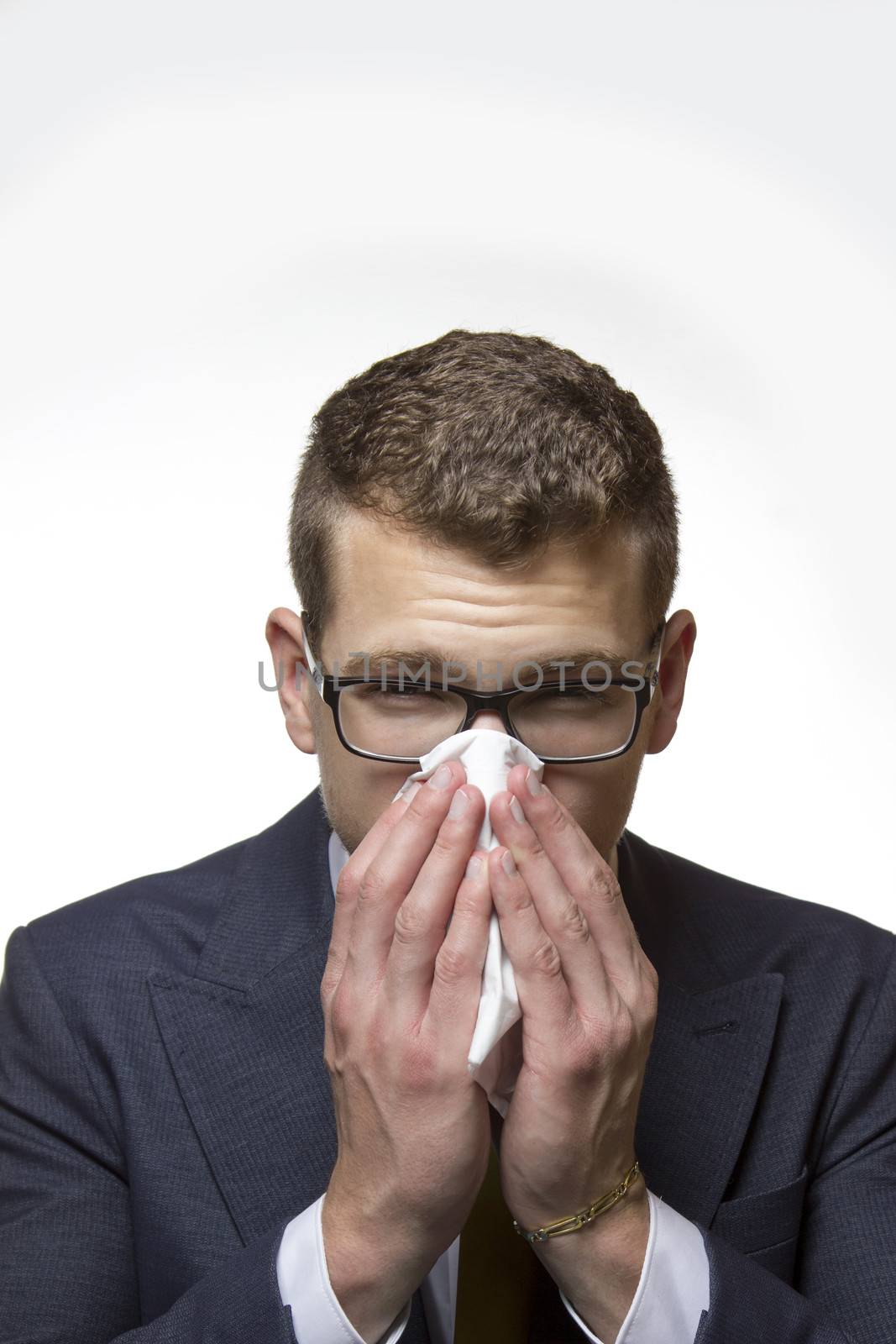 Young business man using a tissue