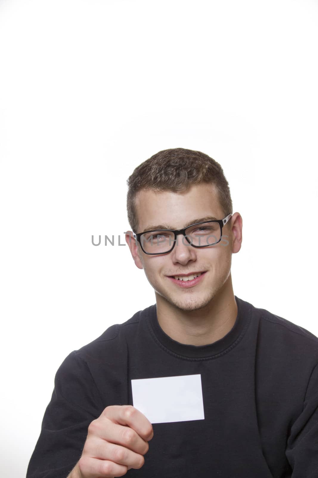 Young welldressed worker or mechanic presenting his business card