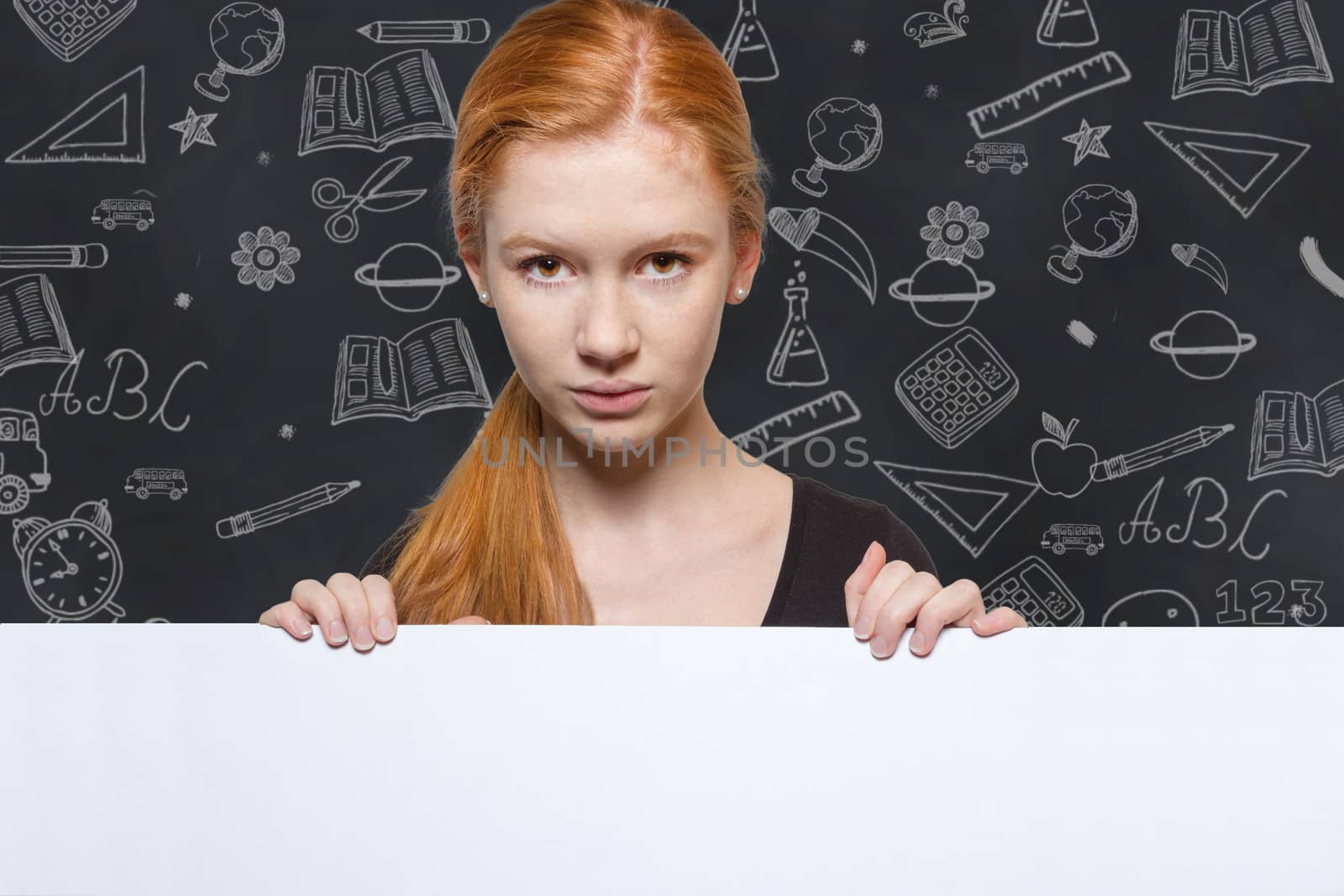 Teen girl holding a sign with copyspace for adverts by Cursedsenses