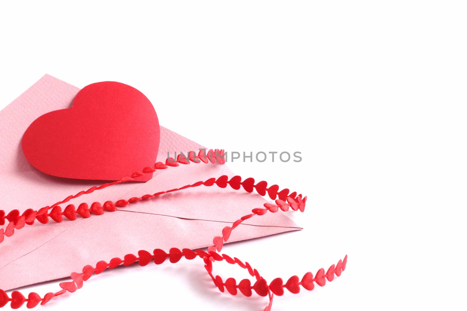 Envelope with red hearts ribbon isolated on white background