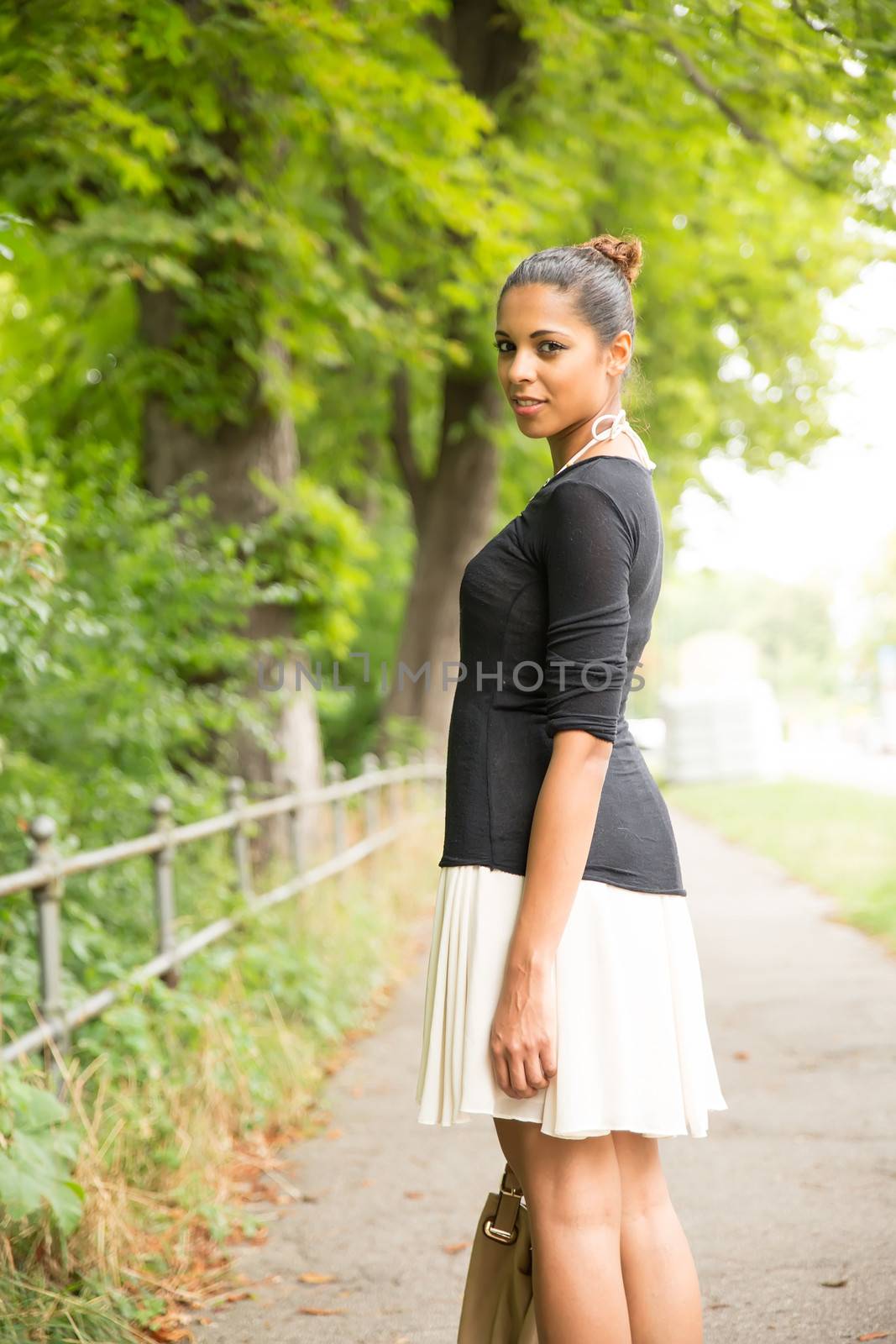Young Girl walking in the park	 by Spectral