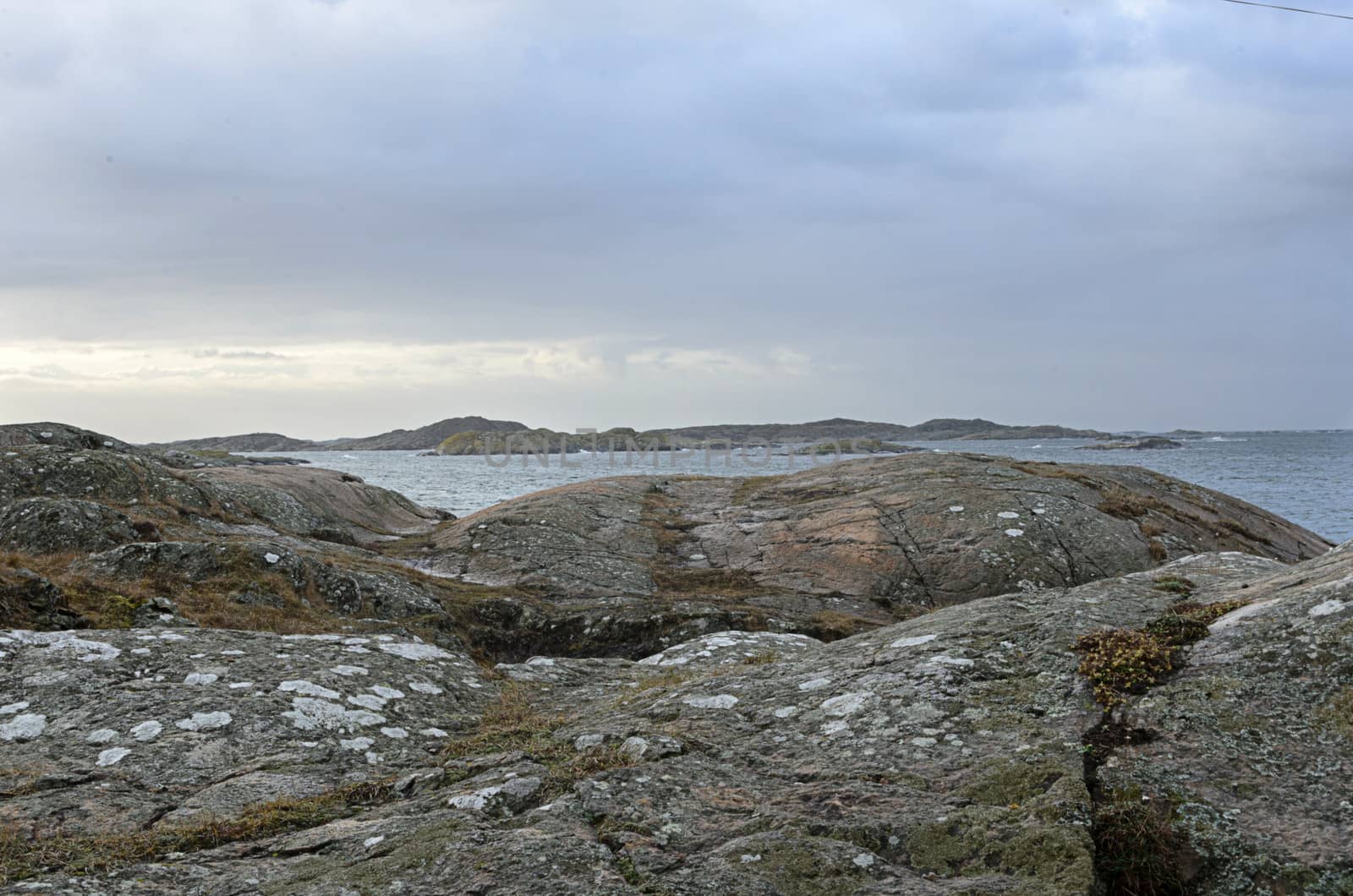 rocks by the sea on a windy and rainy day