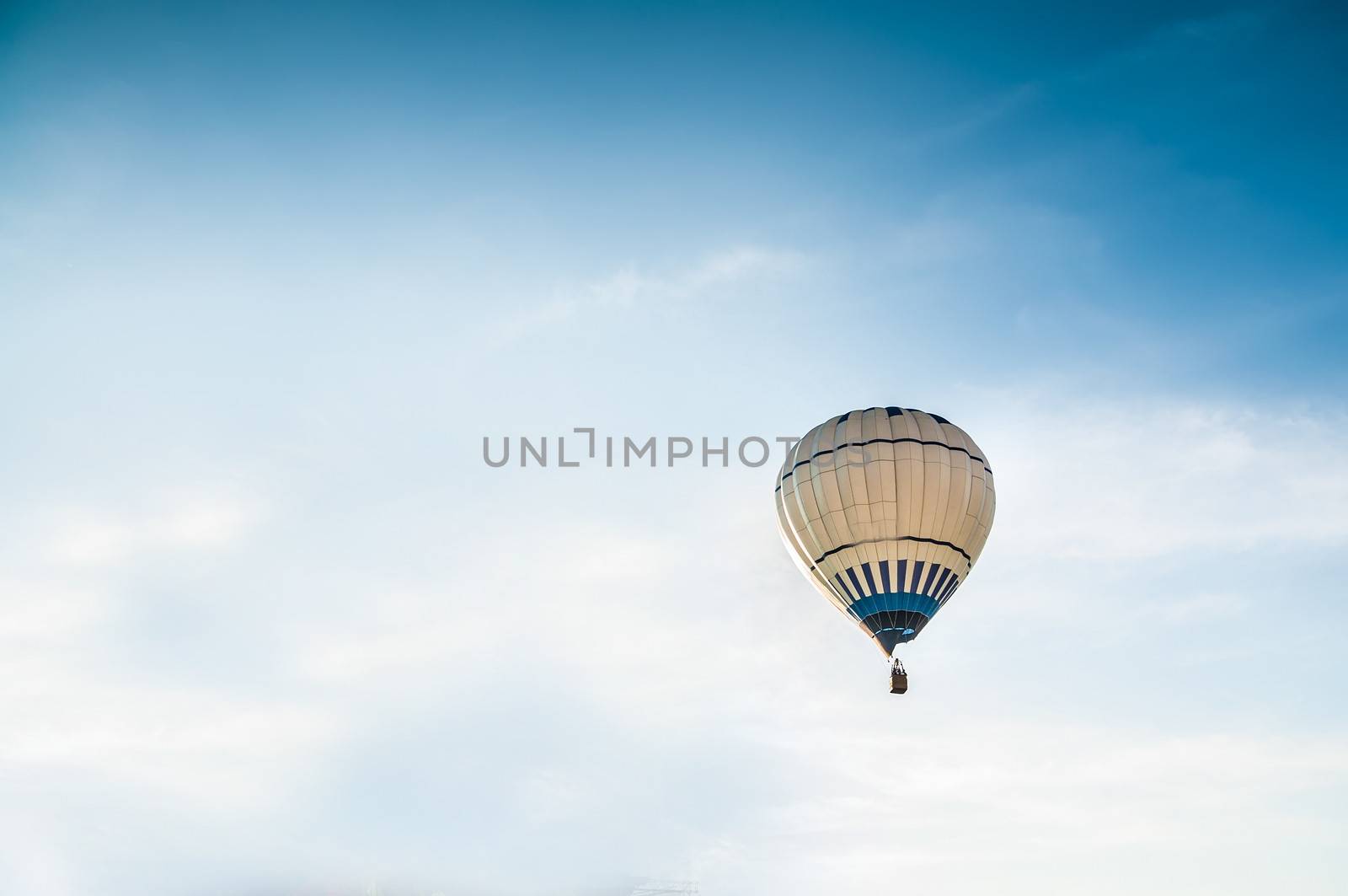 Air balloon on the blue sky background
