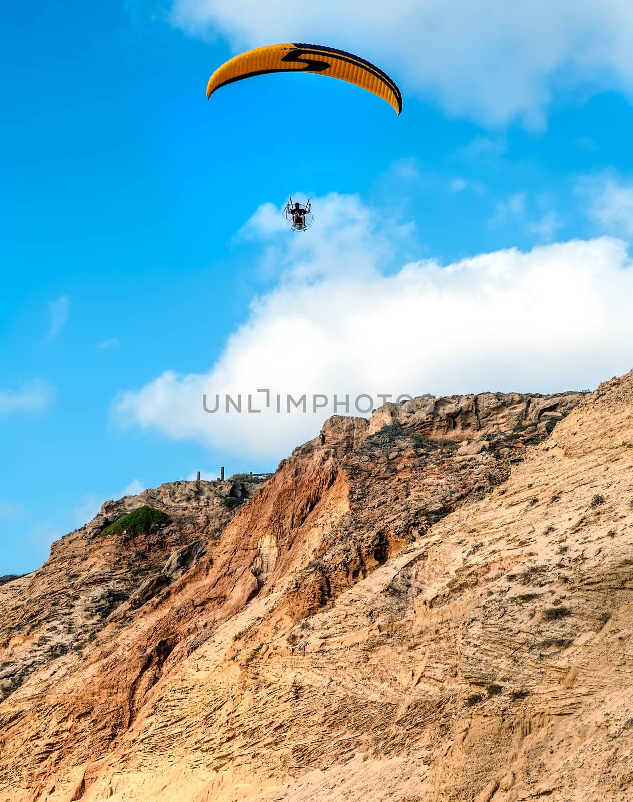 Paragliding over the coast of Mediterranean sea in Israel