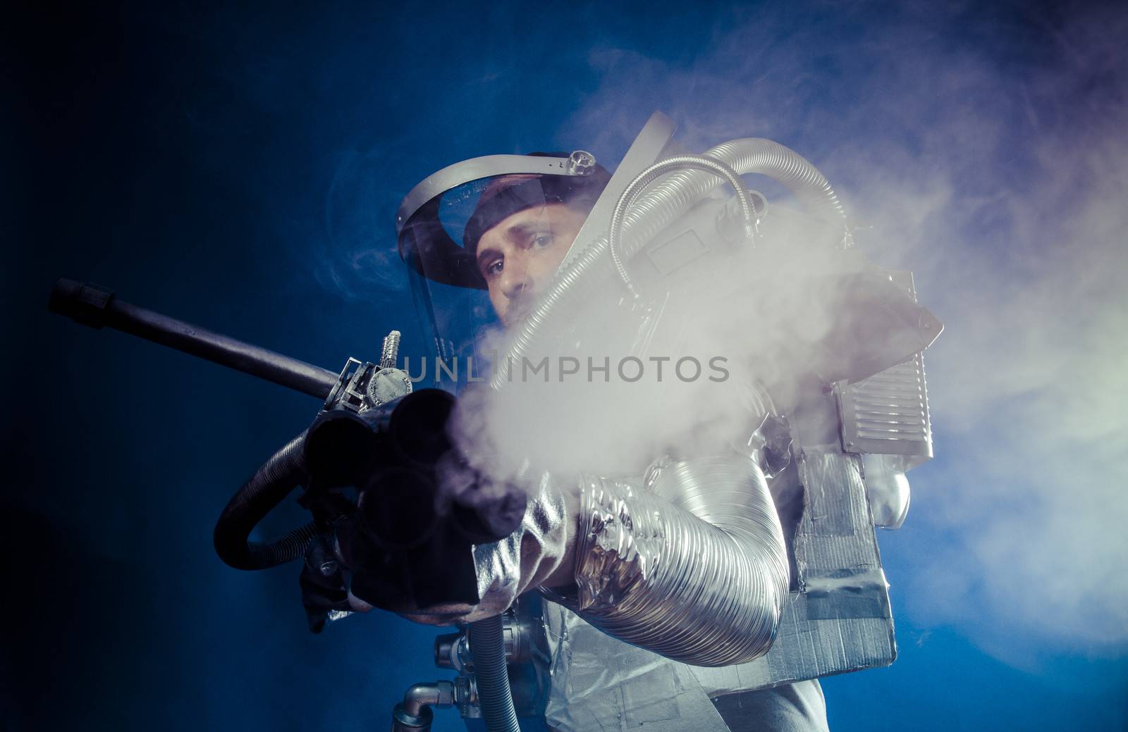 Pressure, Astronaut on a black background with huge weapon.