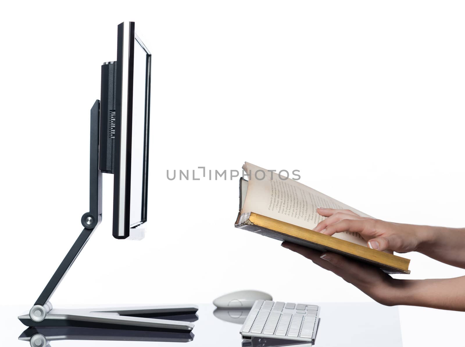 communication between human hand and a computer display monitor on isolated white background expressing book reading concept