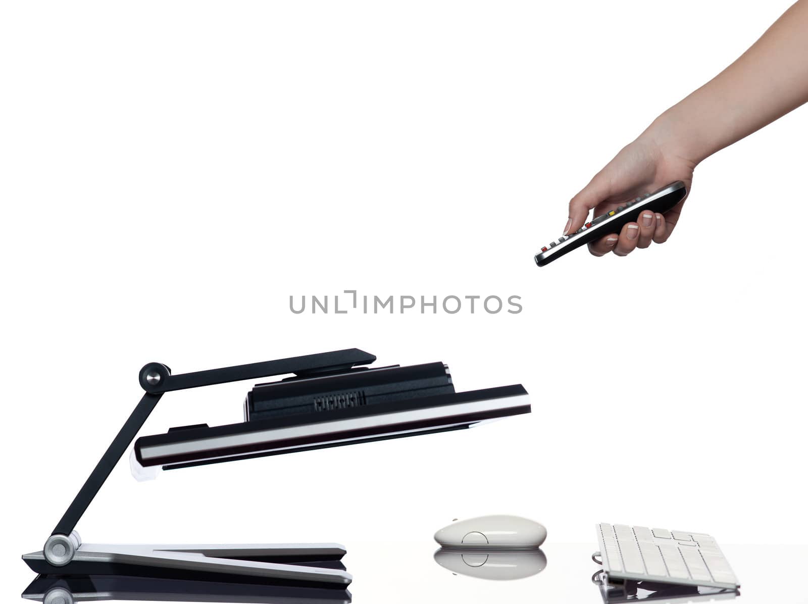 human hand holding remote control and a computer display monitor on isolated white background expressing failure concept