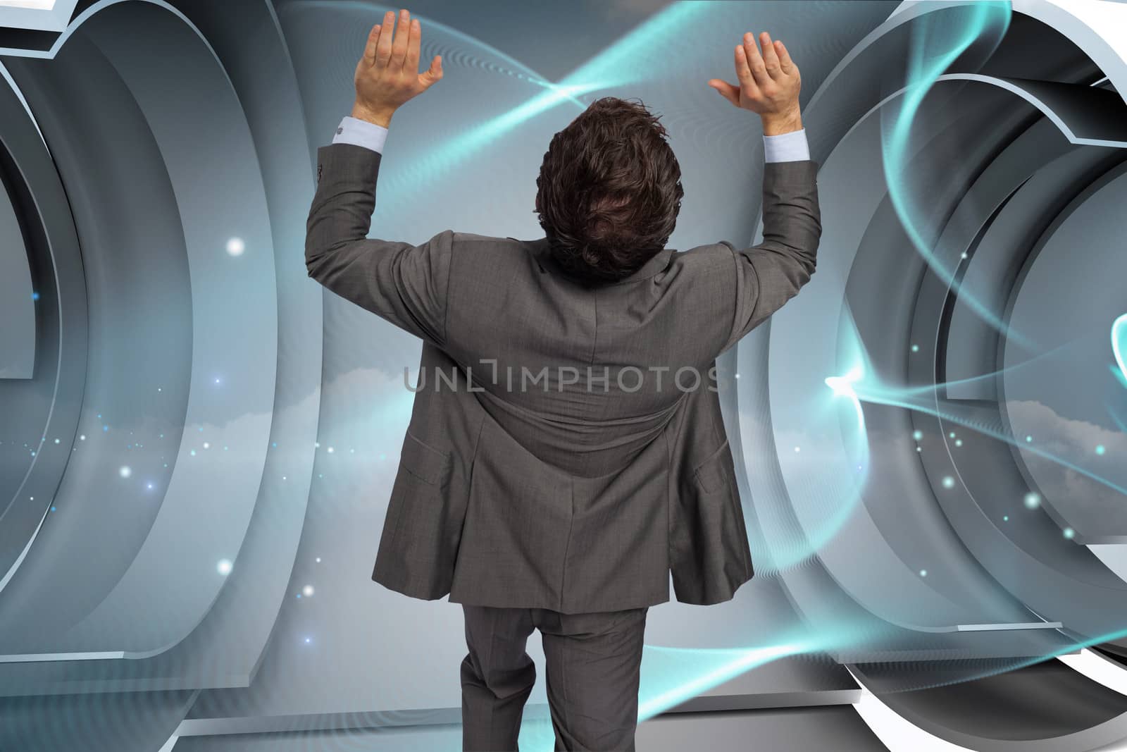 Businessman standing with arms pressing up against blue abstract design in structure 