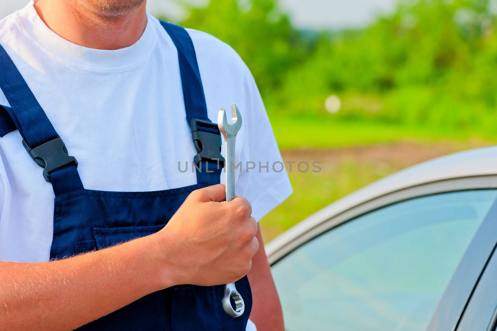 mechanic in a suit with a wrench by kosmsos111