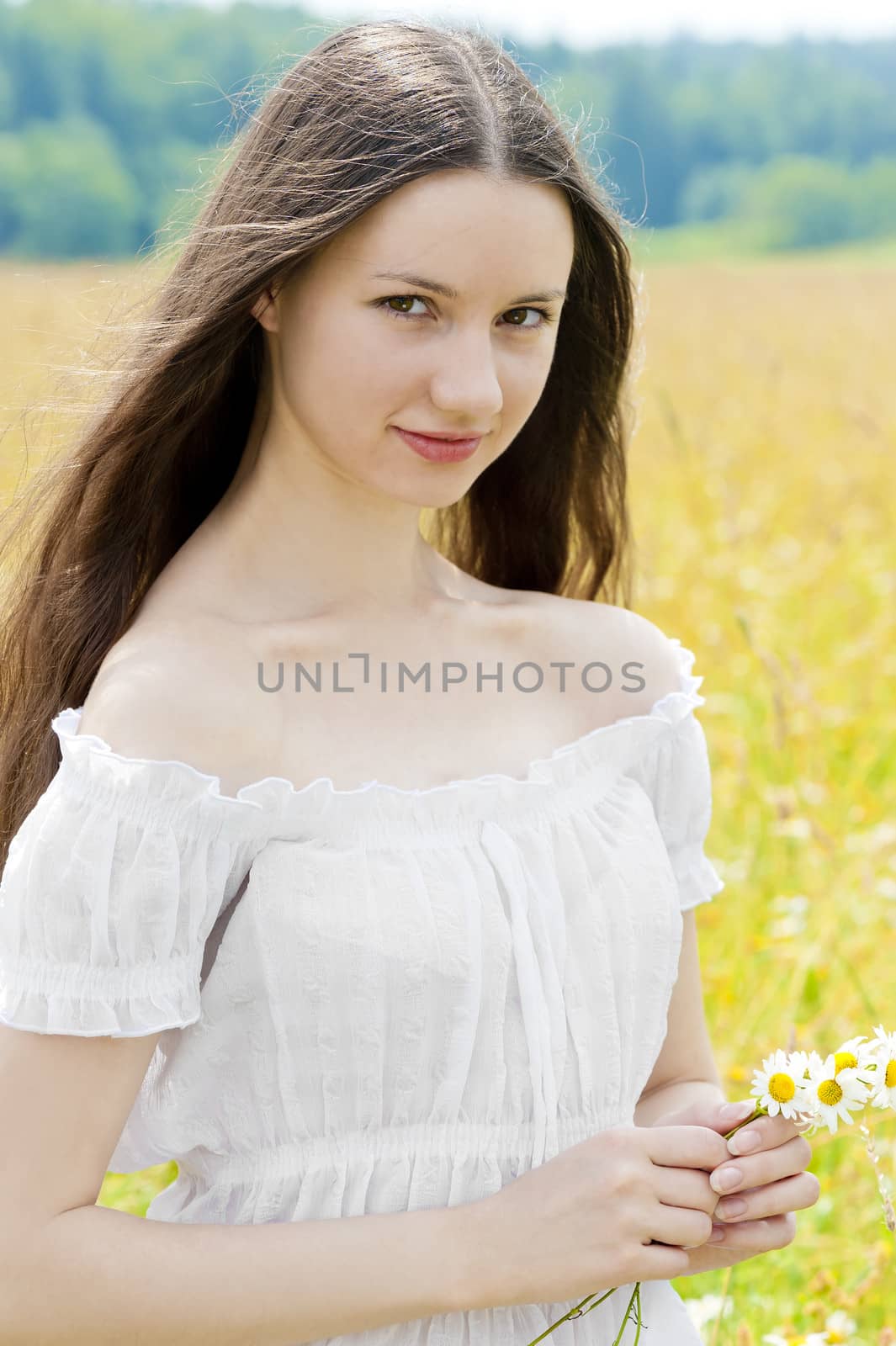 portrait of Russian beauties in a field with flowers