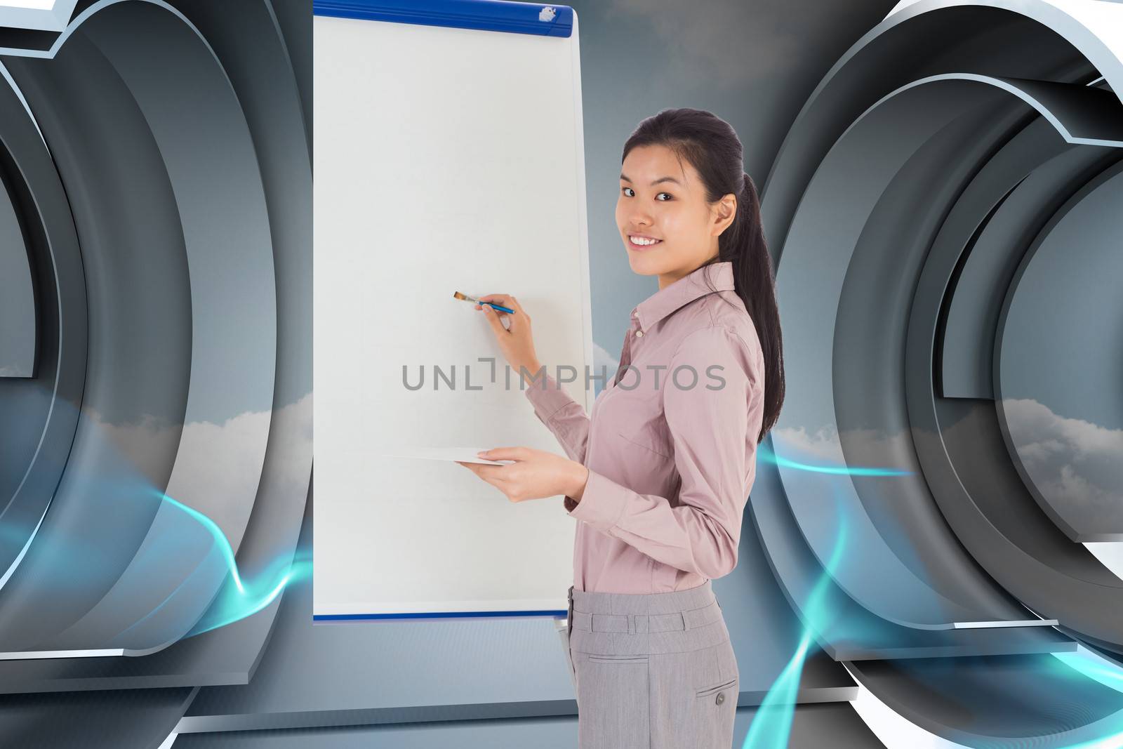 Businesswoman painting on an easel against abstract design in blue