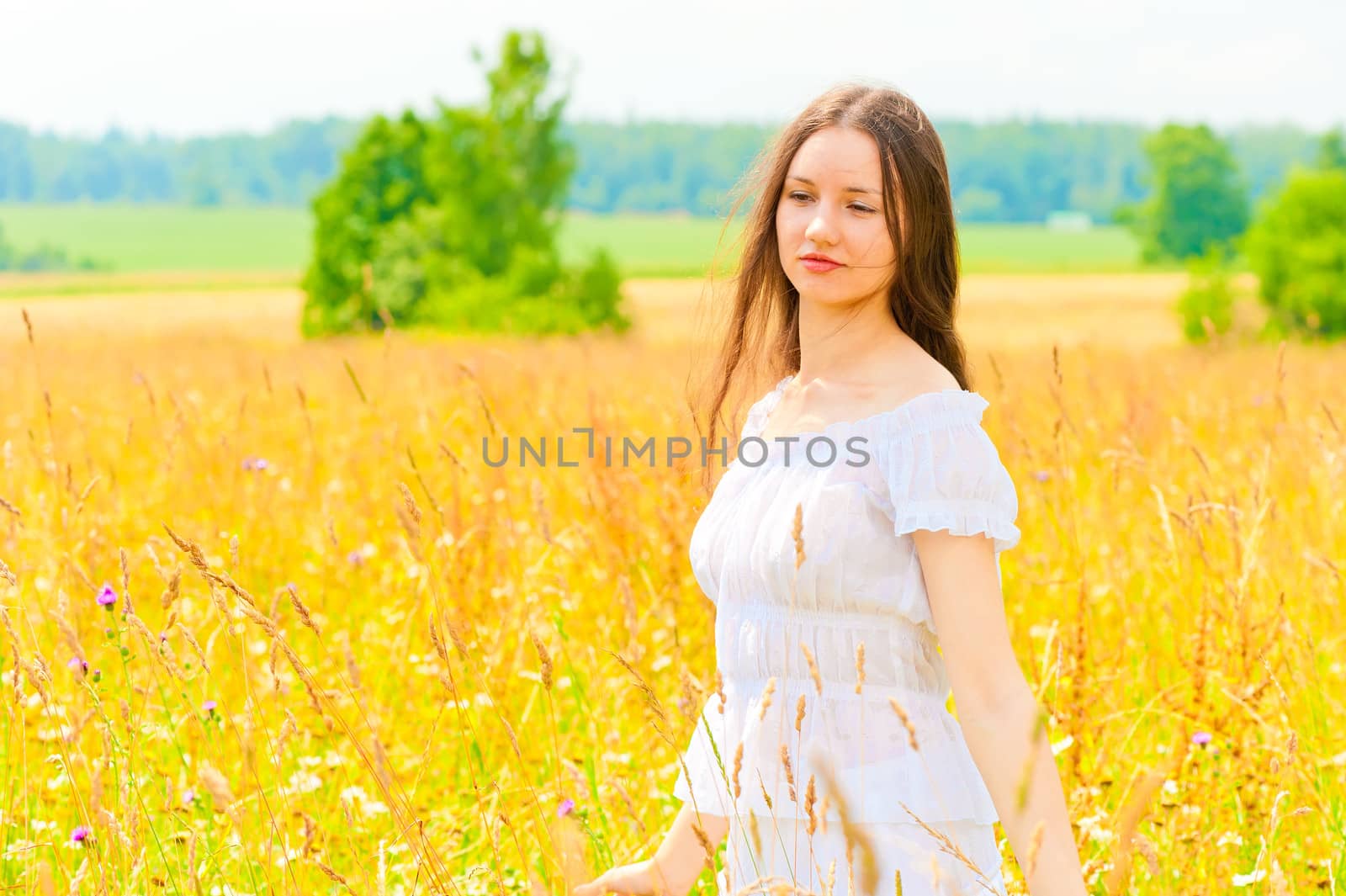 young woman in yellow flower field by kosmsos111