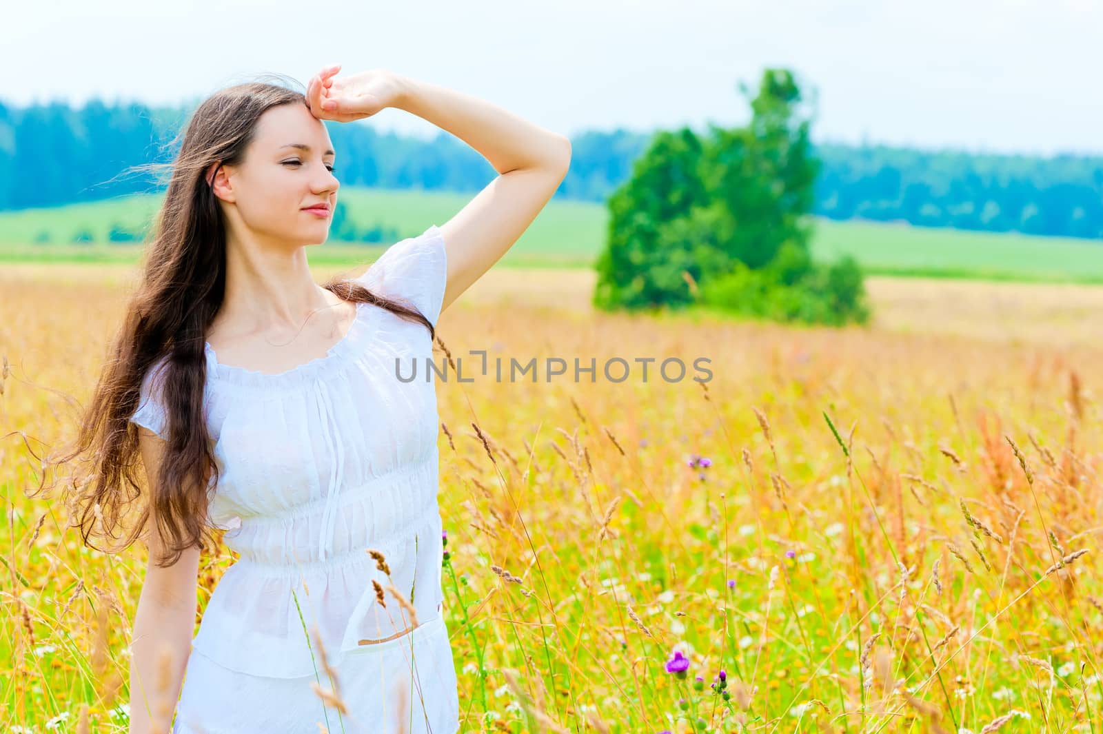 happy girl in field with flowers