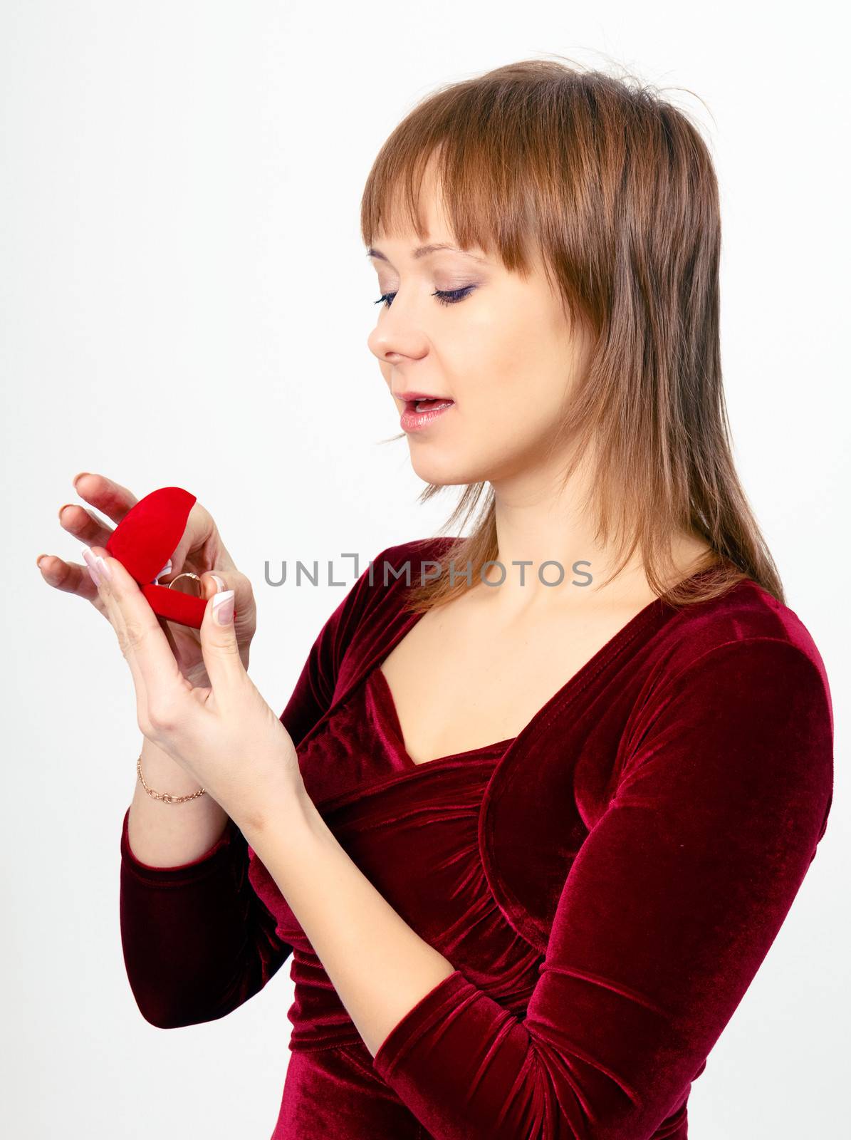 young beautiful woman opens the ring box