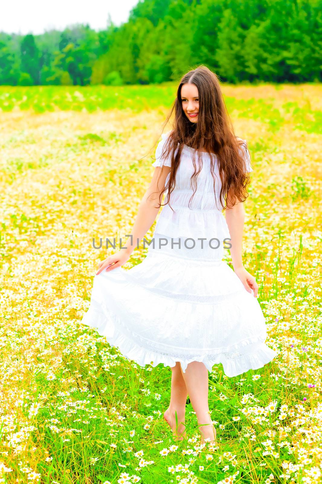 Russian beauty in a rural field with flowers