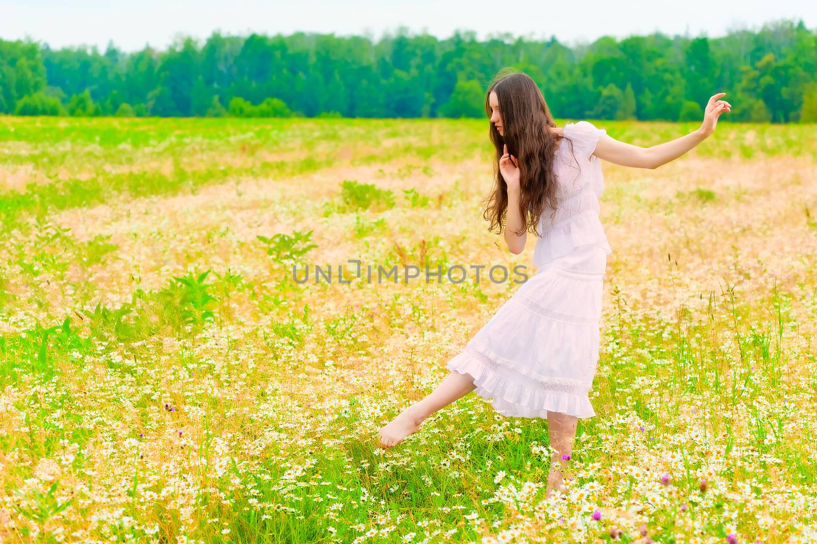 young ballerina dancing in a field with daisies by kosmsos111