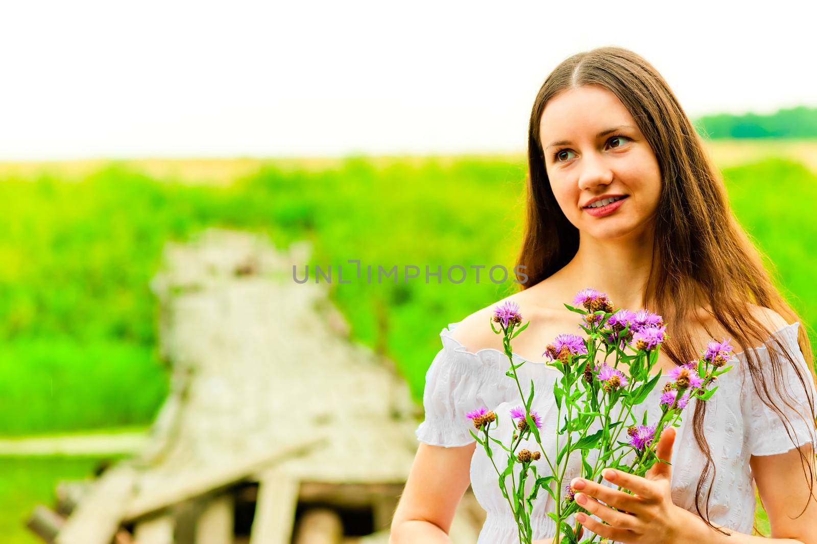 portrait of a beautiful girl with a bouquet on a background of f by kosmsos111