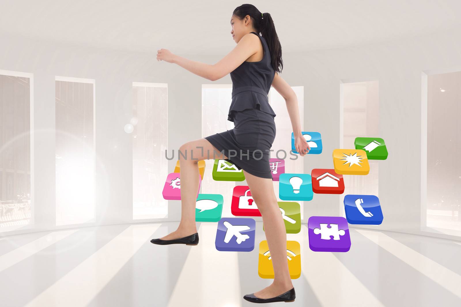 Composite image of businesswoman stepping up by Wavebreakmedia