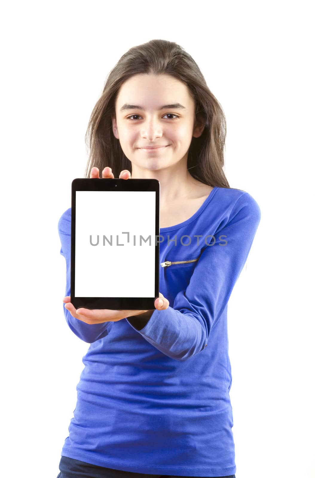 Happy teen girl show digital tablet on white background. Focus on tablet pc.