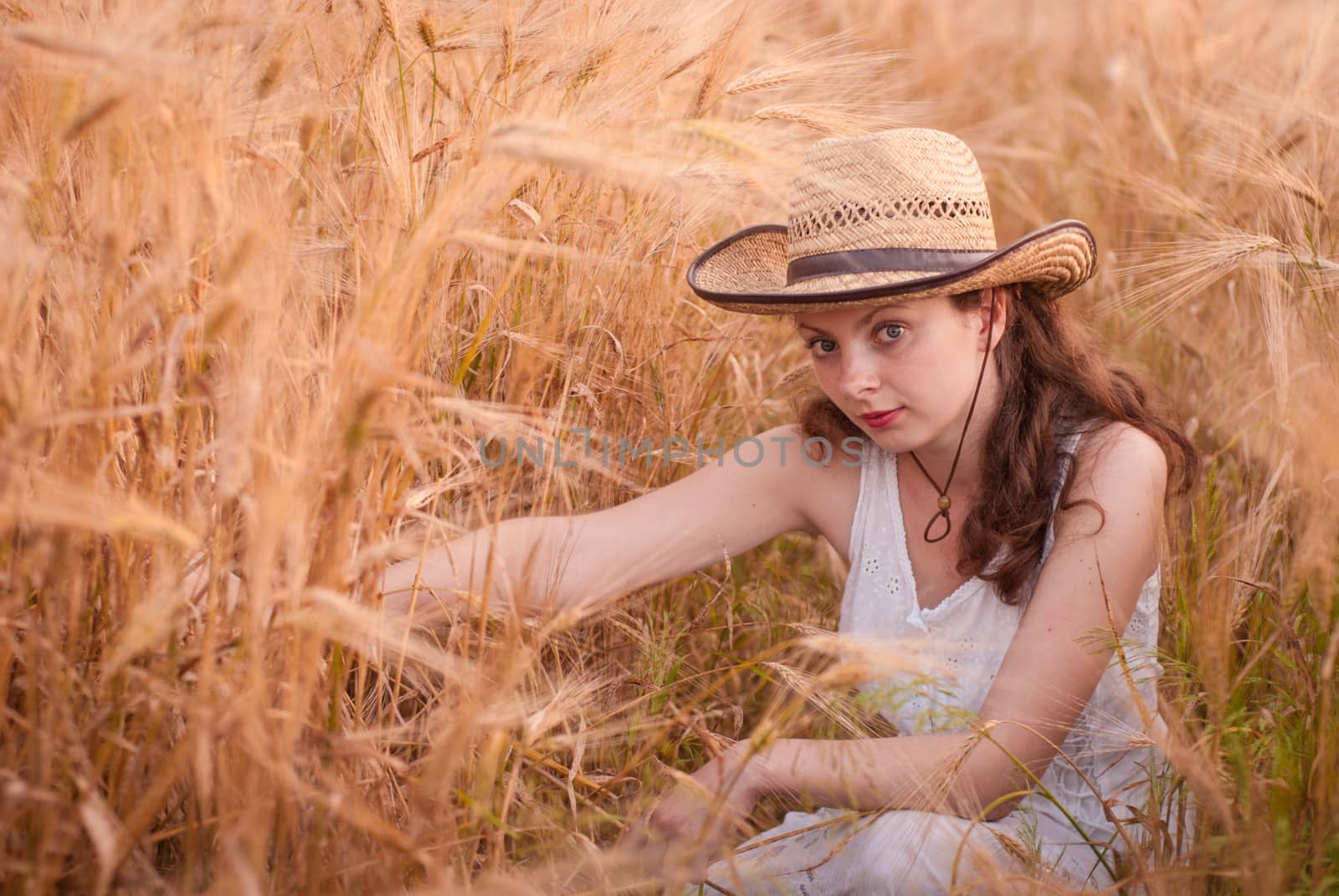 Woman in the wheat field, farmer with crop