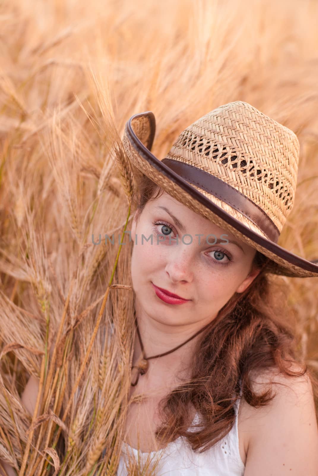 Woman in the wheat field, farmer with crop