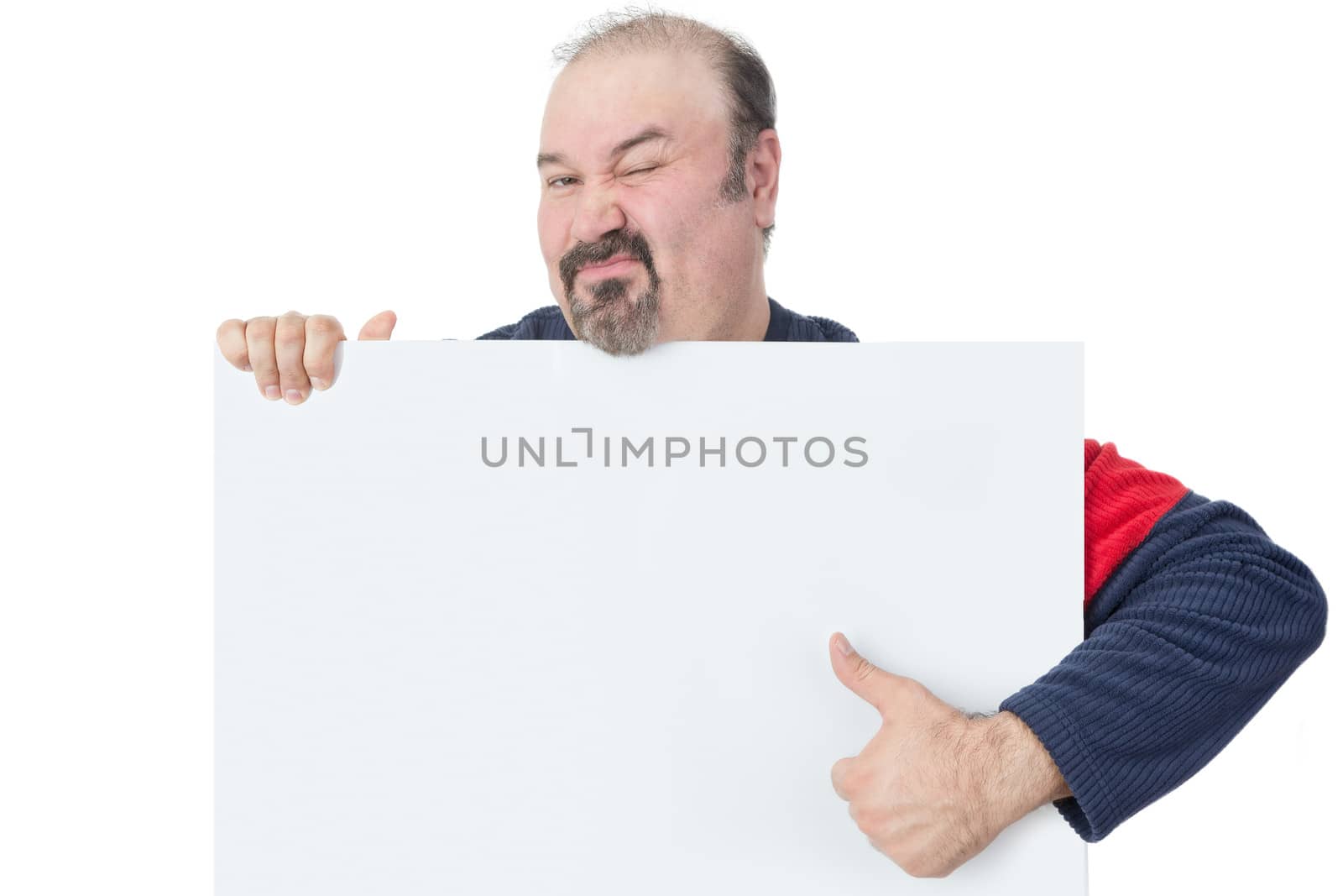 Man holding a blank billboard and giving thumbs-up by coskun