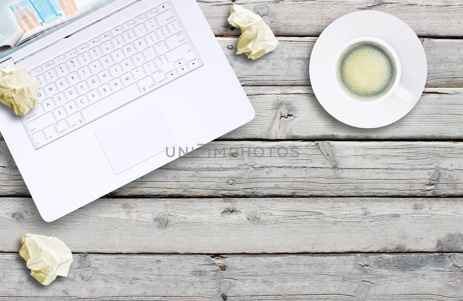 Laptop and coffee cup on old wooden boards. Computer technology concept