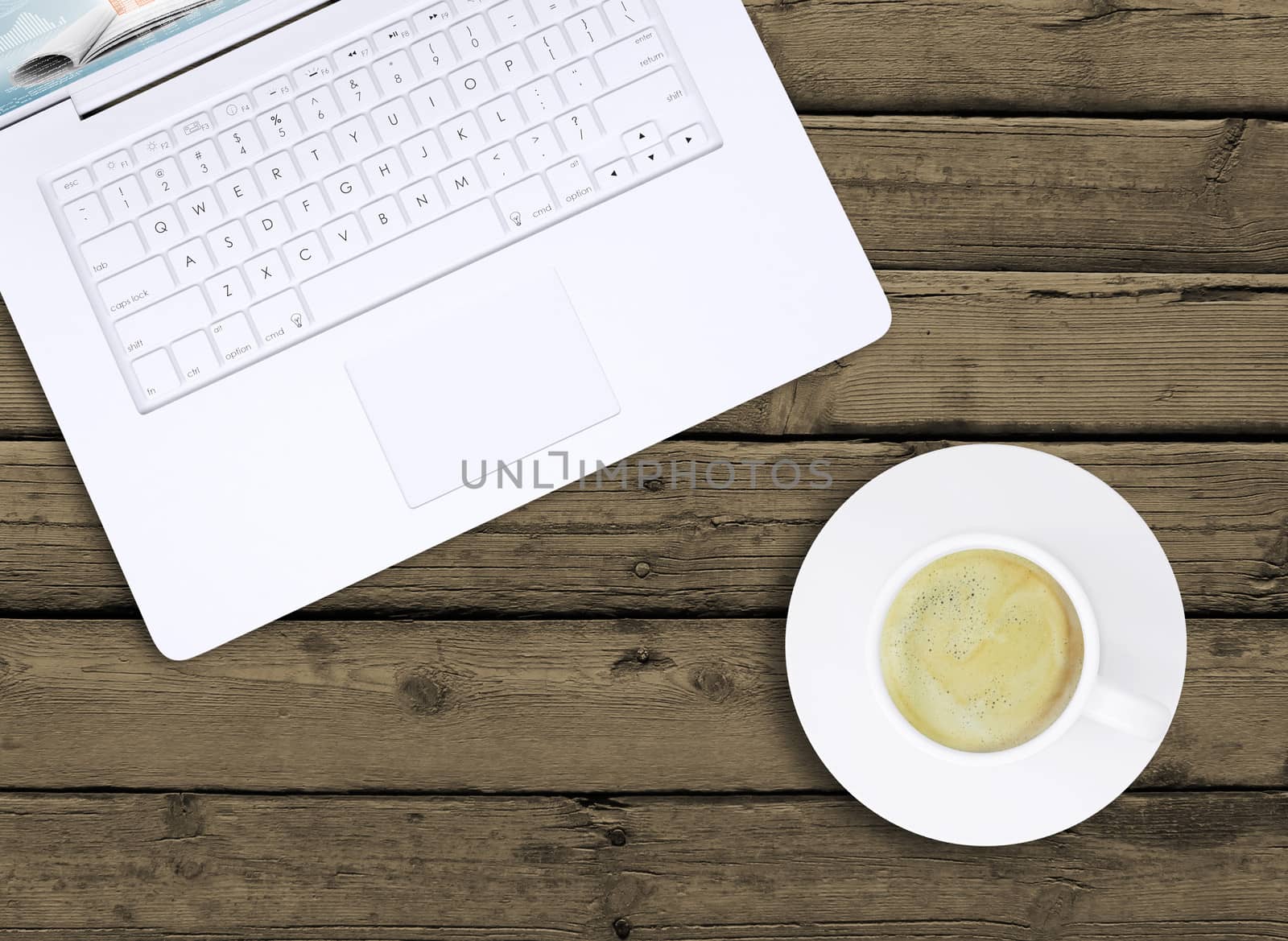 Laptop and a cup of coffee with crema by cherezoff