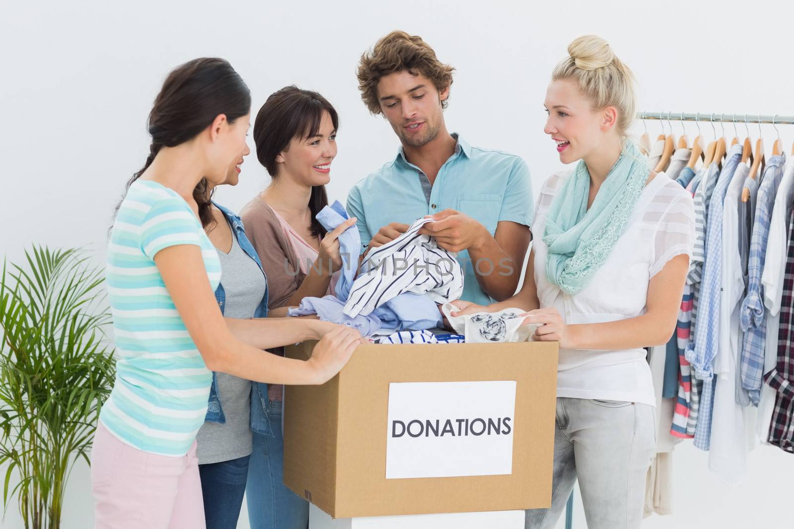 Group of young people with clothes donation