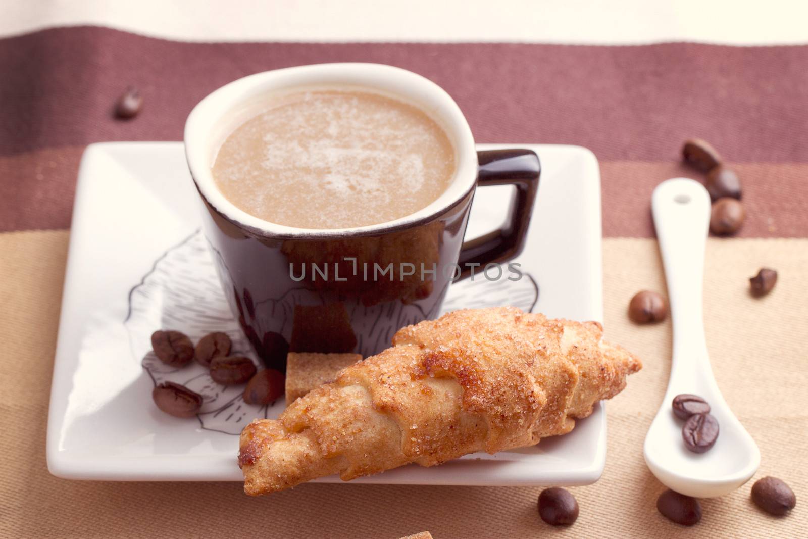 Coffee served with croissant and sfogliatella