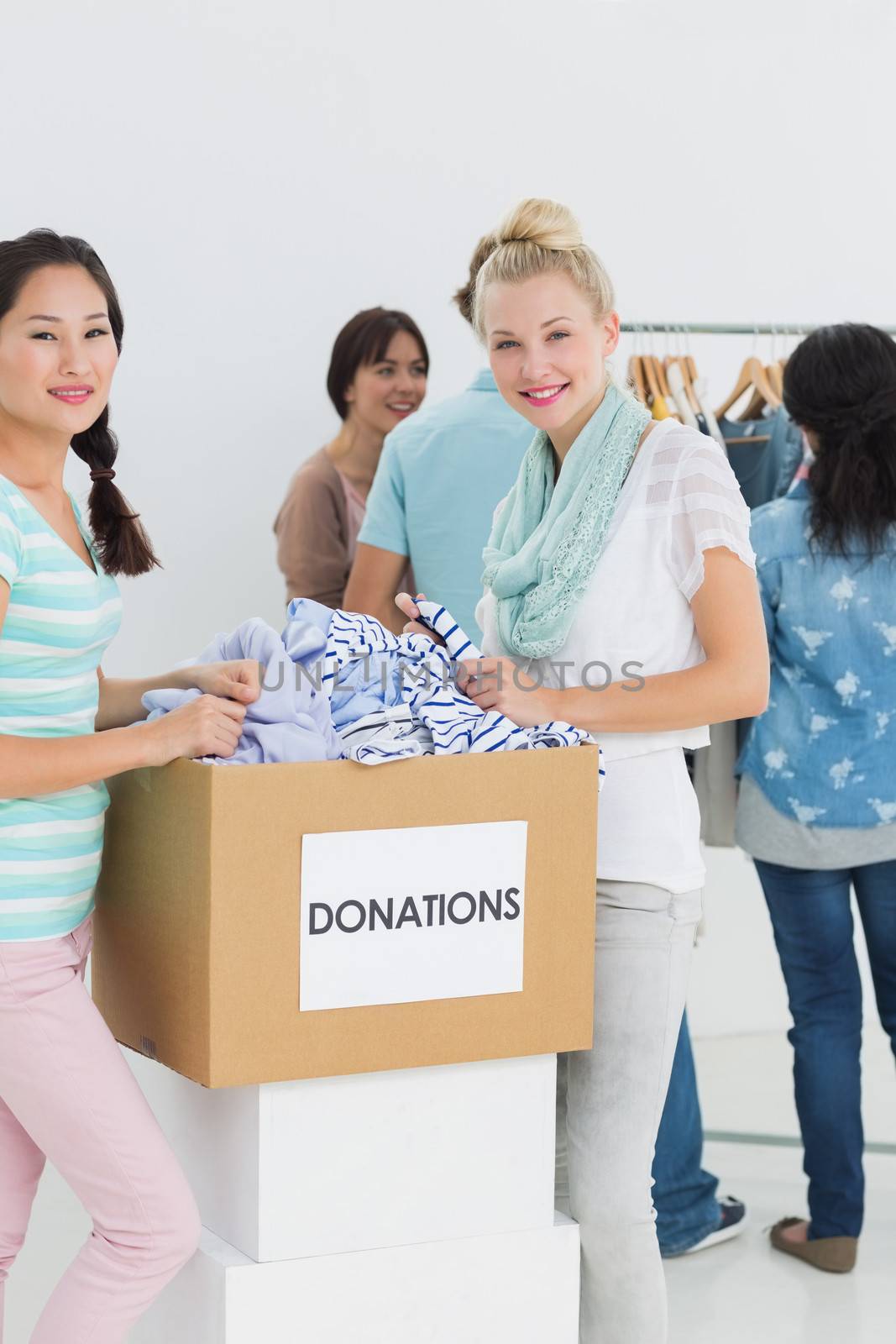 Group of young people with clothes donation