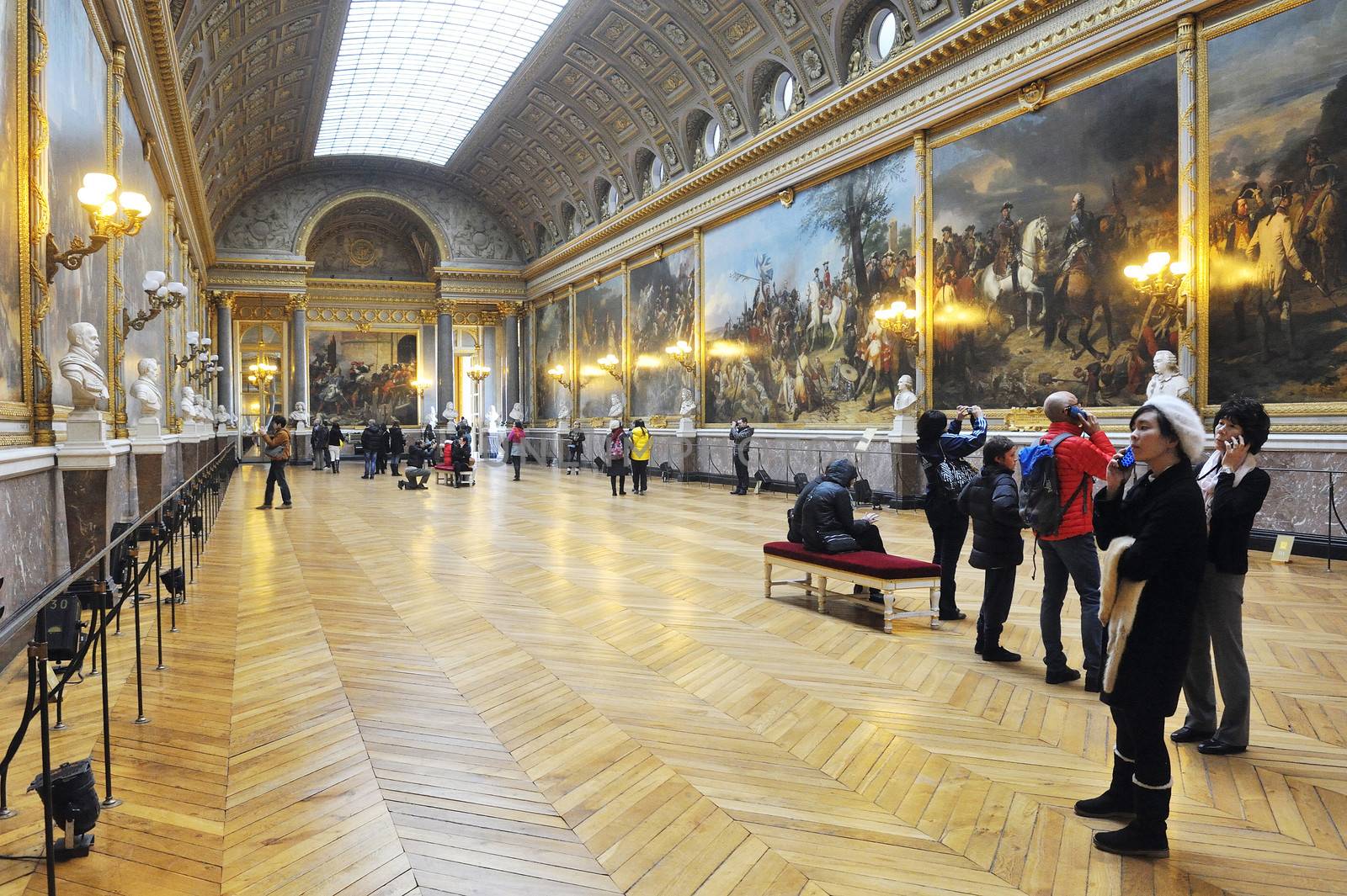 tourists visiting the castle of Versailles