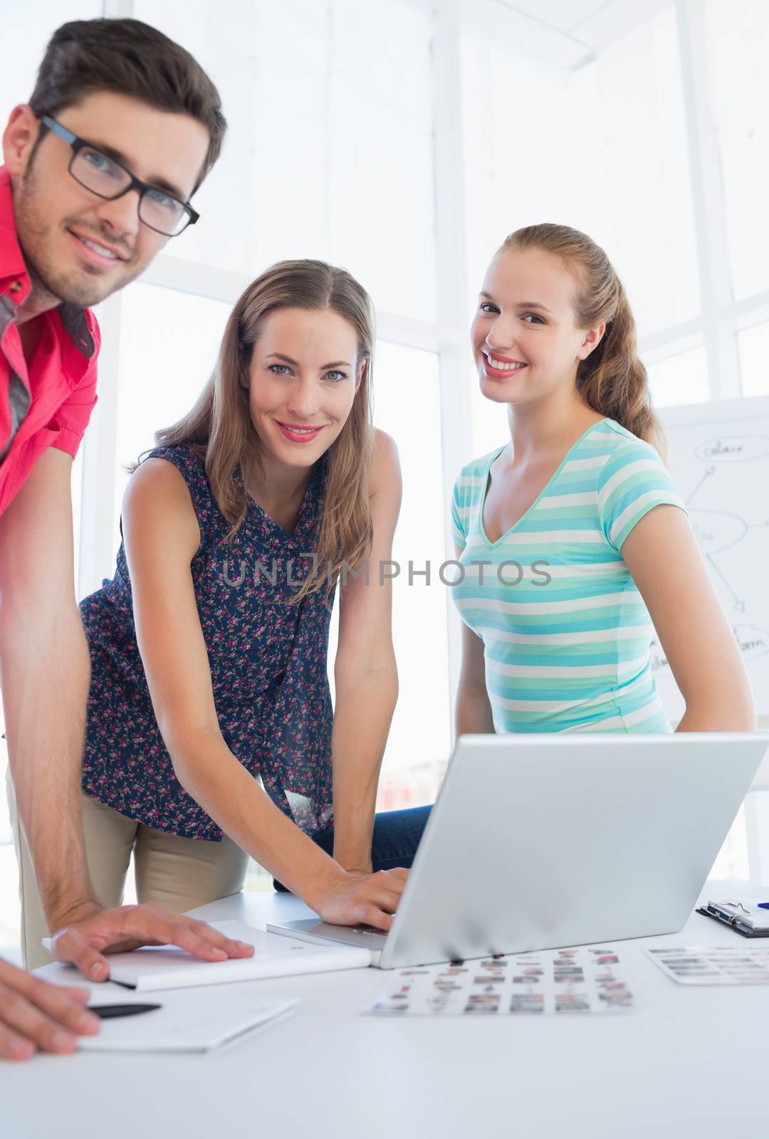Portrait of young casual people in the meeting room