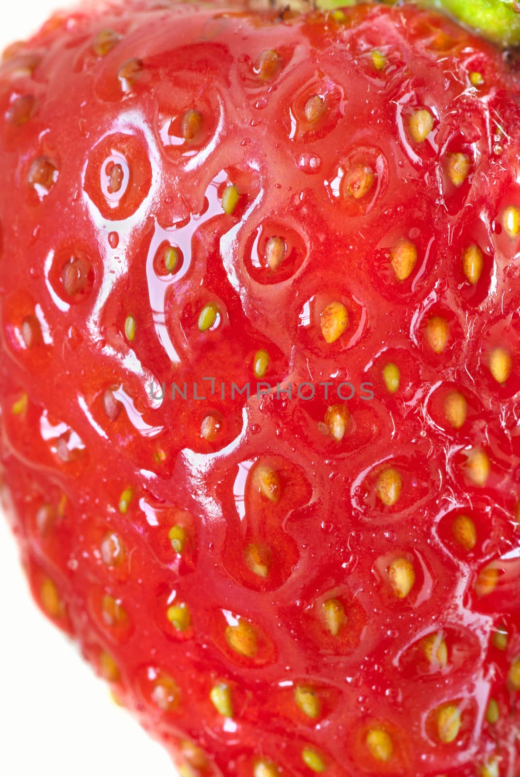 Macro of a ripe strawberry, side view.