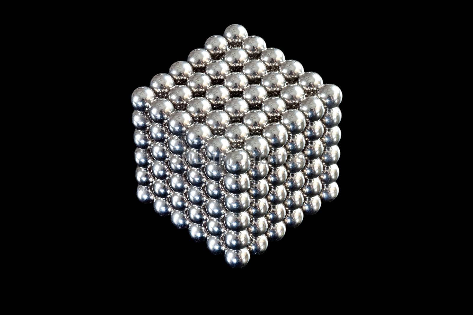 Close-up of a cube composed of magnetic balls.