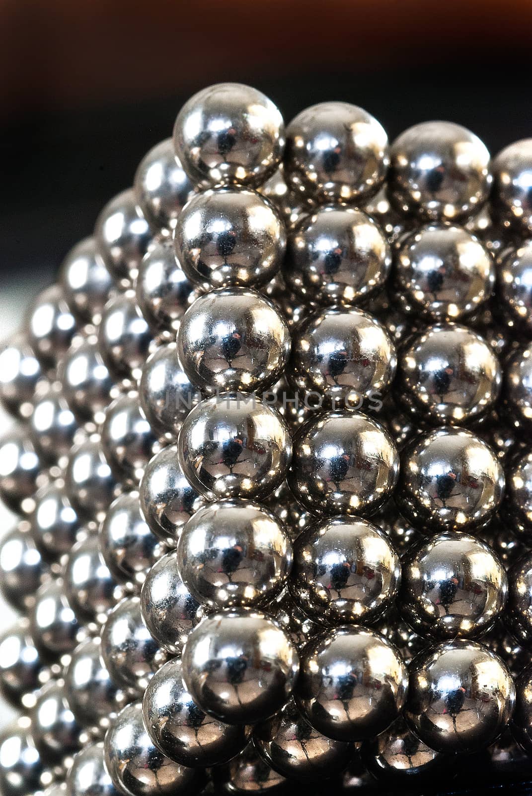 Macro schot of a cube composed of magnetic balls.