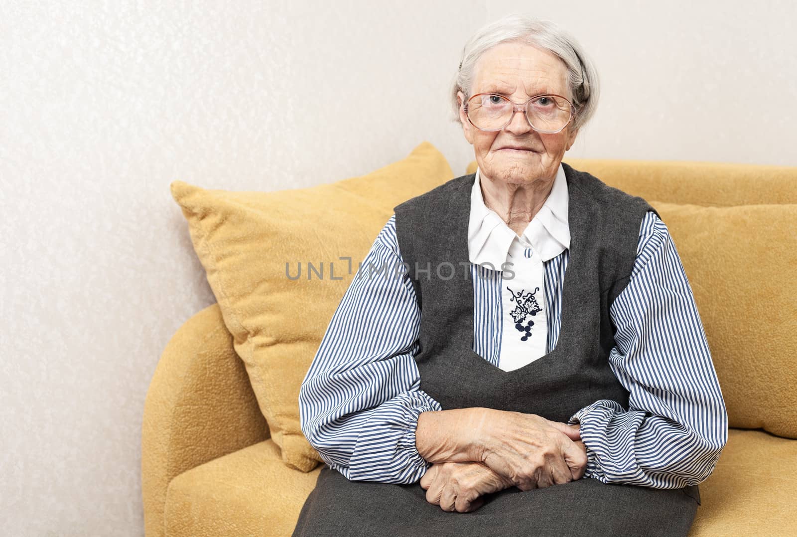 Portrait of a senior woman looking at camera by photobac