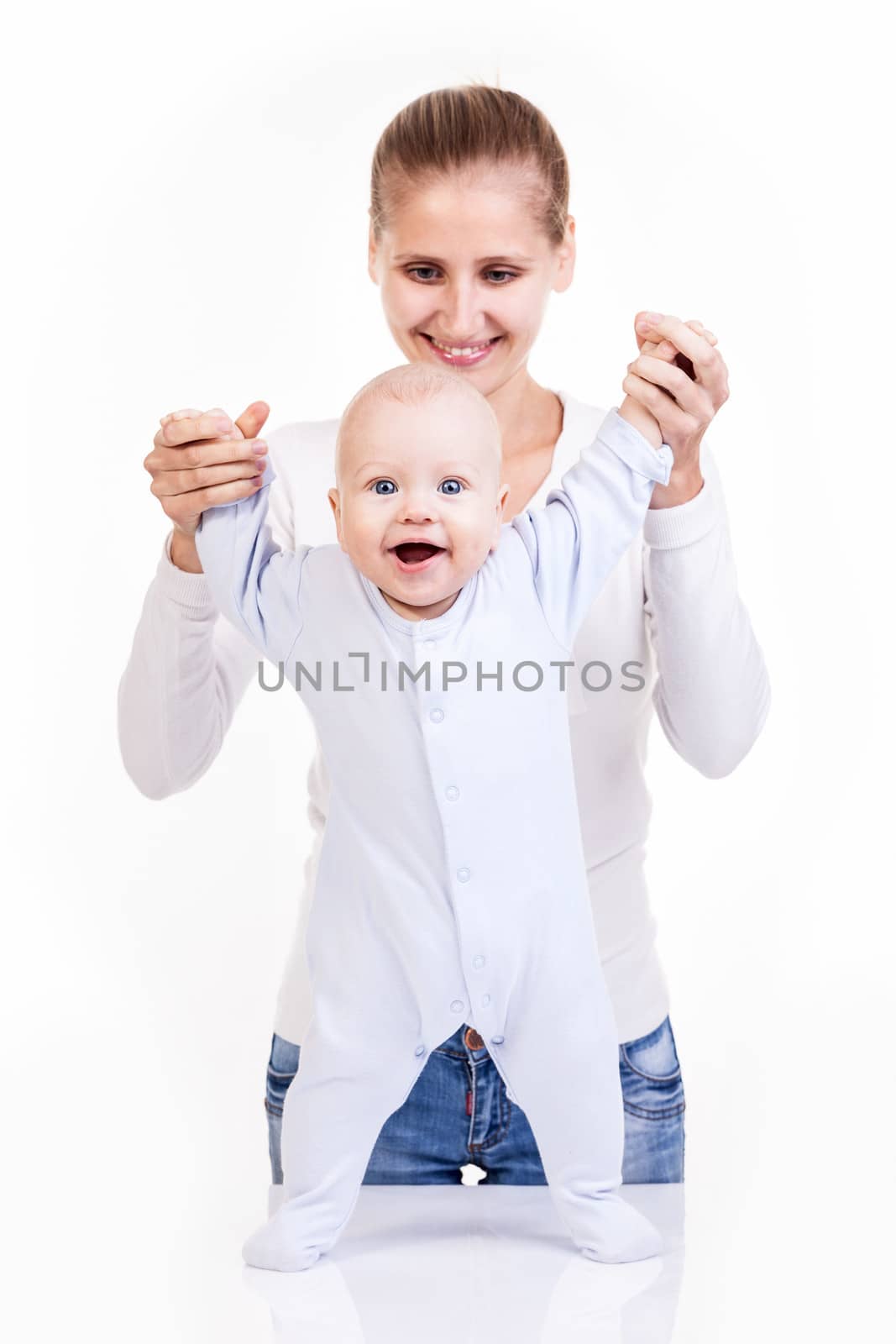 Happy young Caucasian woman and her baby son over white