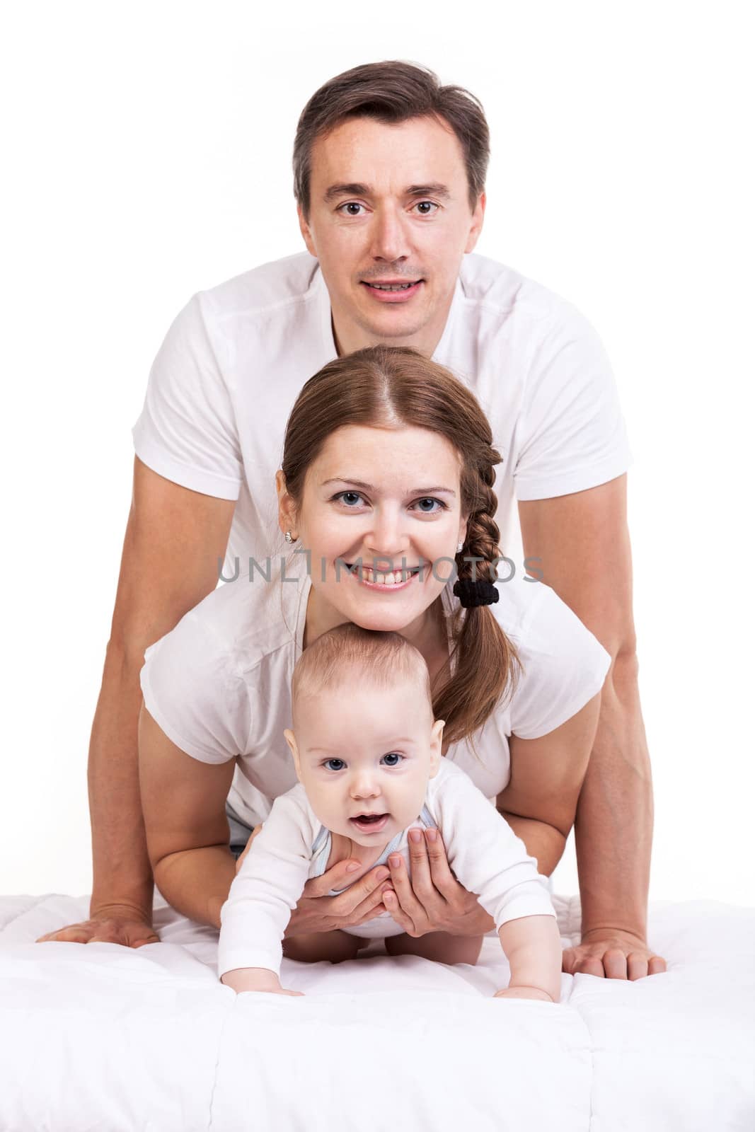 Young family with baby boy over white by photobac