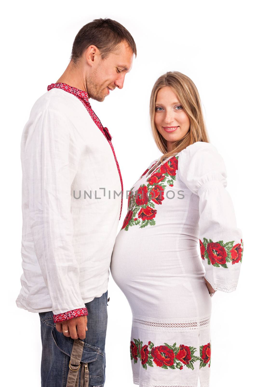 Young couple in Ukrainian style costumes on white by photobac