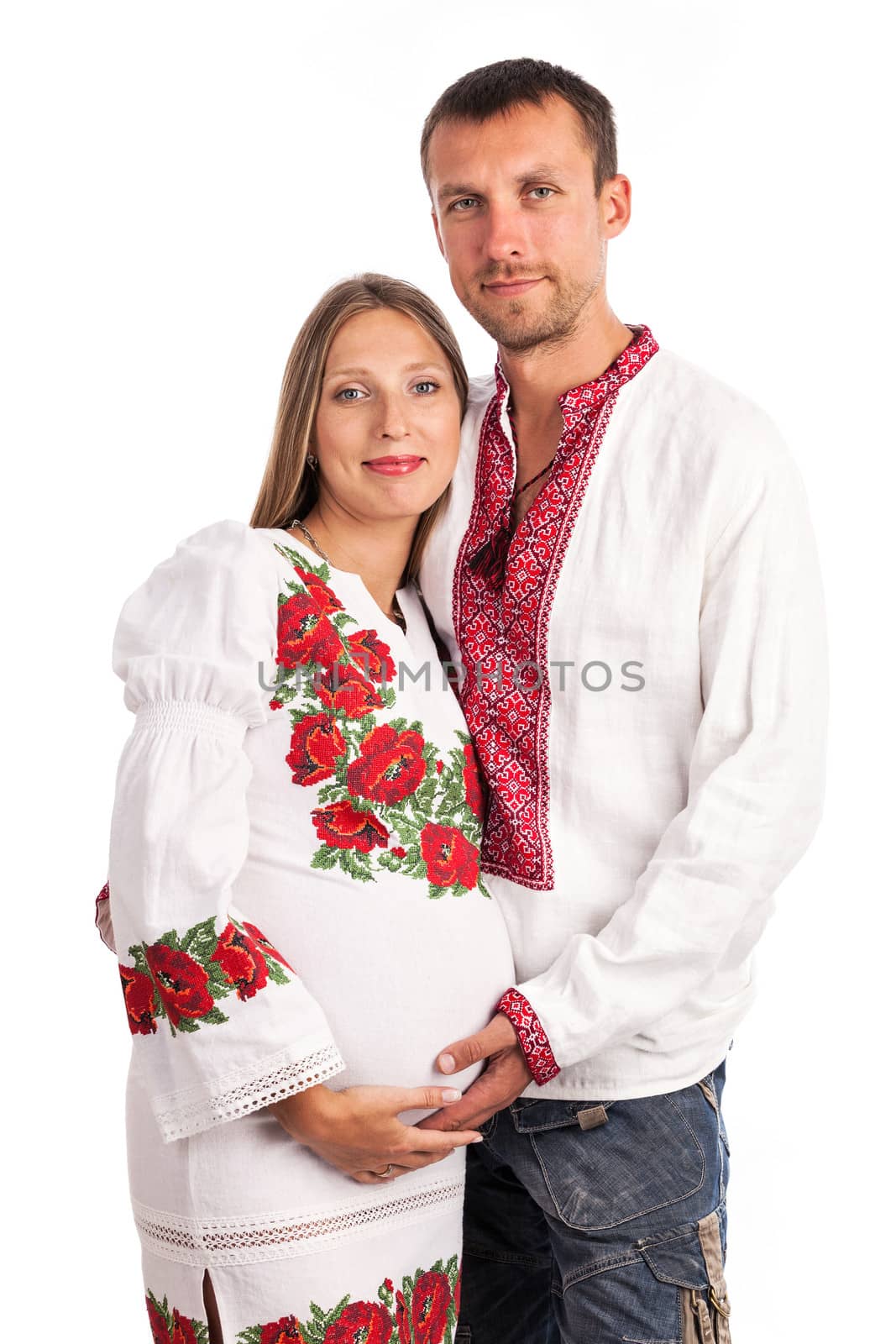 Young couple in Ukrainian style clothing over white
