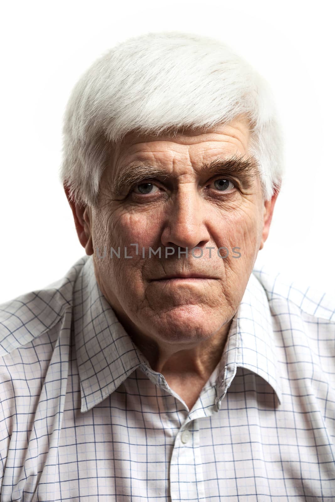 Portrait of a handsome mature man looking at camera. Isolated on white background