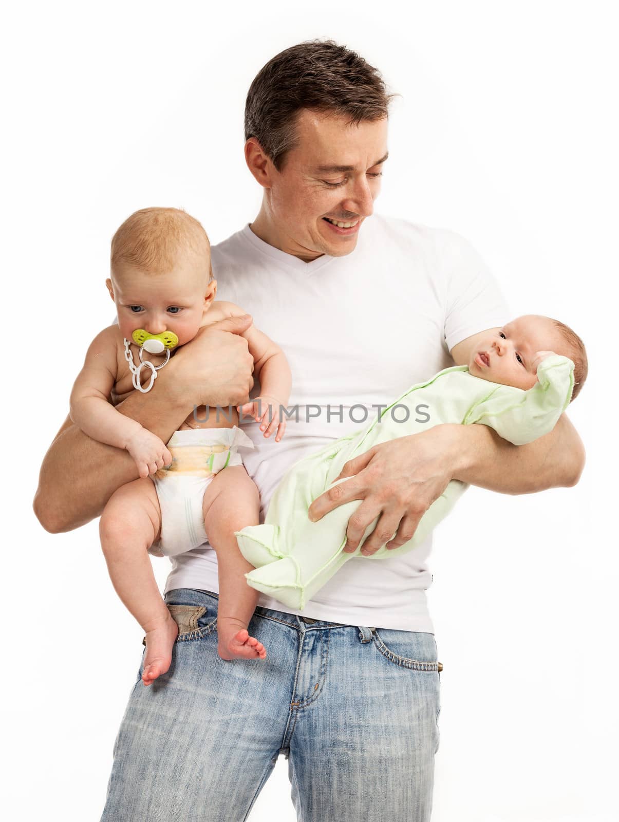Smiling young man with two baby boys over white by photobac