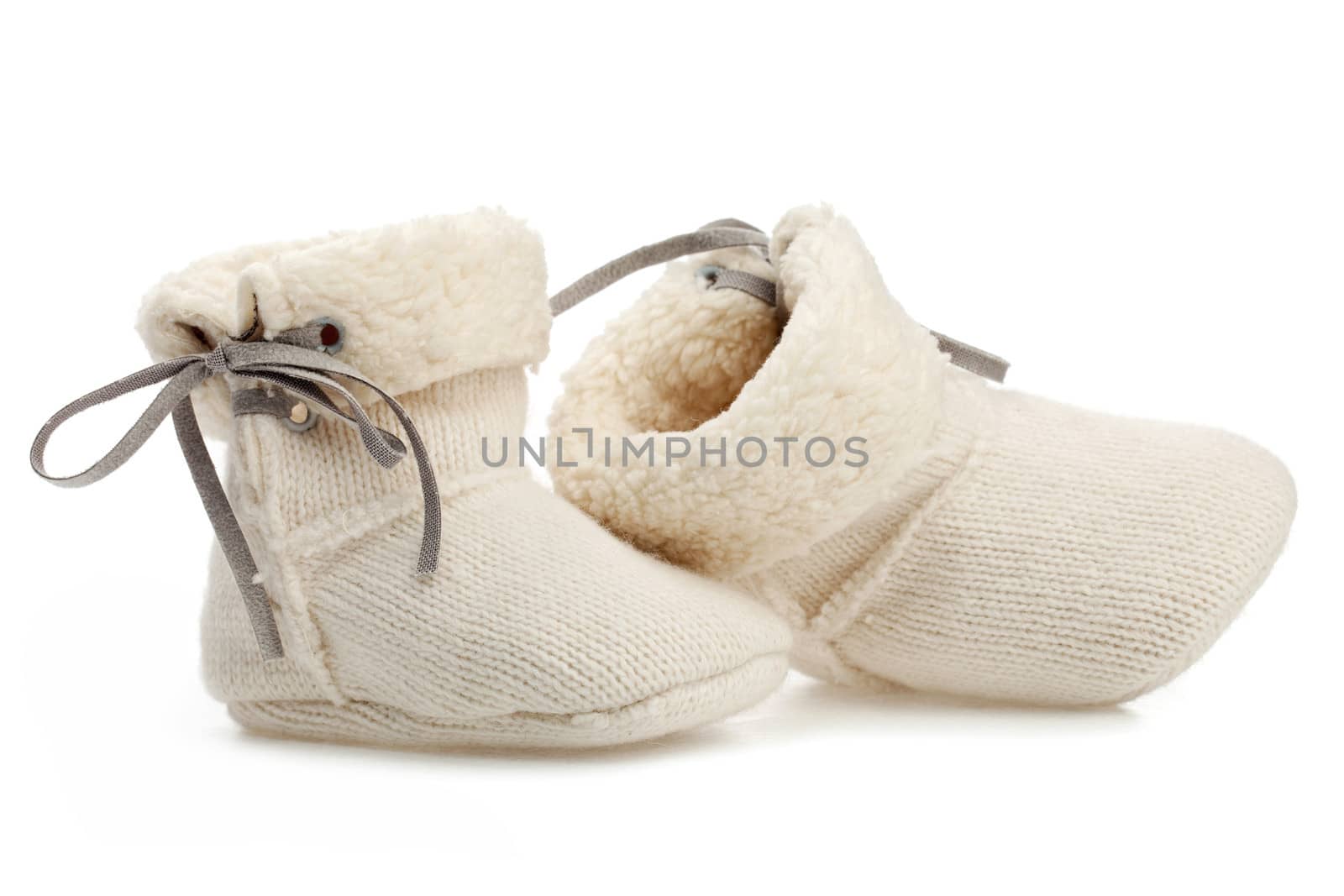 Pair of baby booties isolated over white background